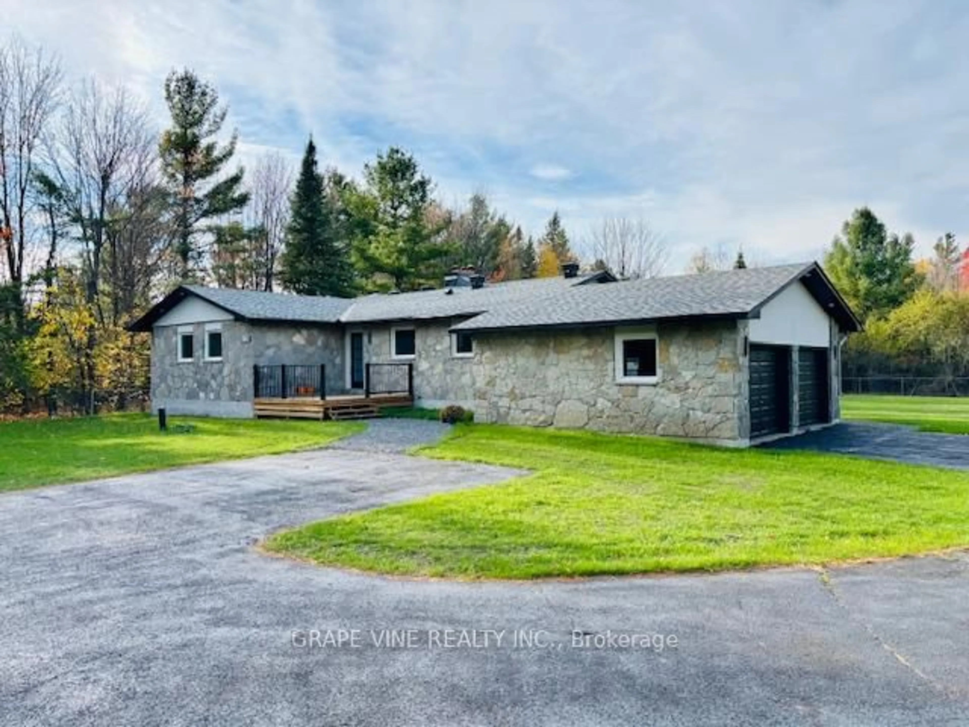 A pic from outside/outdoor area/front of a property/back of a property/a pic from drone, unknown for 135 Manion Rd, Carp Ontario K0A 1L0