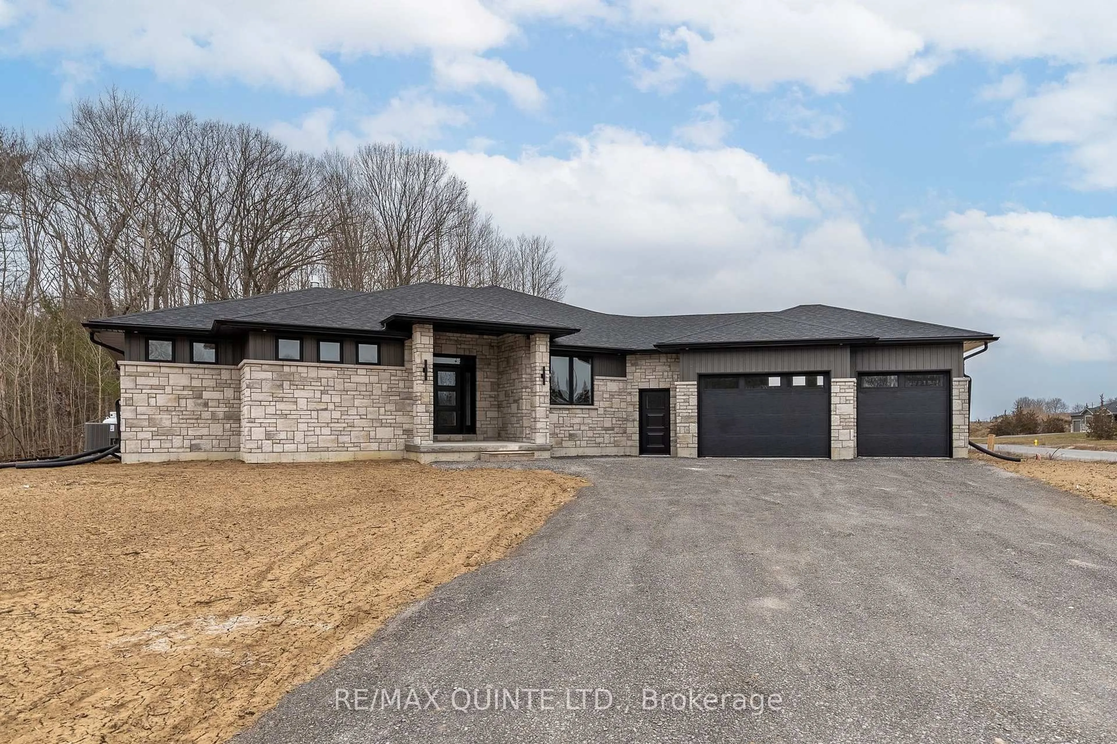 Home with brick exterior material, street for 235 Michael's Way, Prince Edward County Ontario K0K 1L0