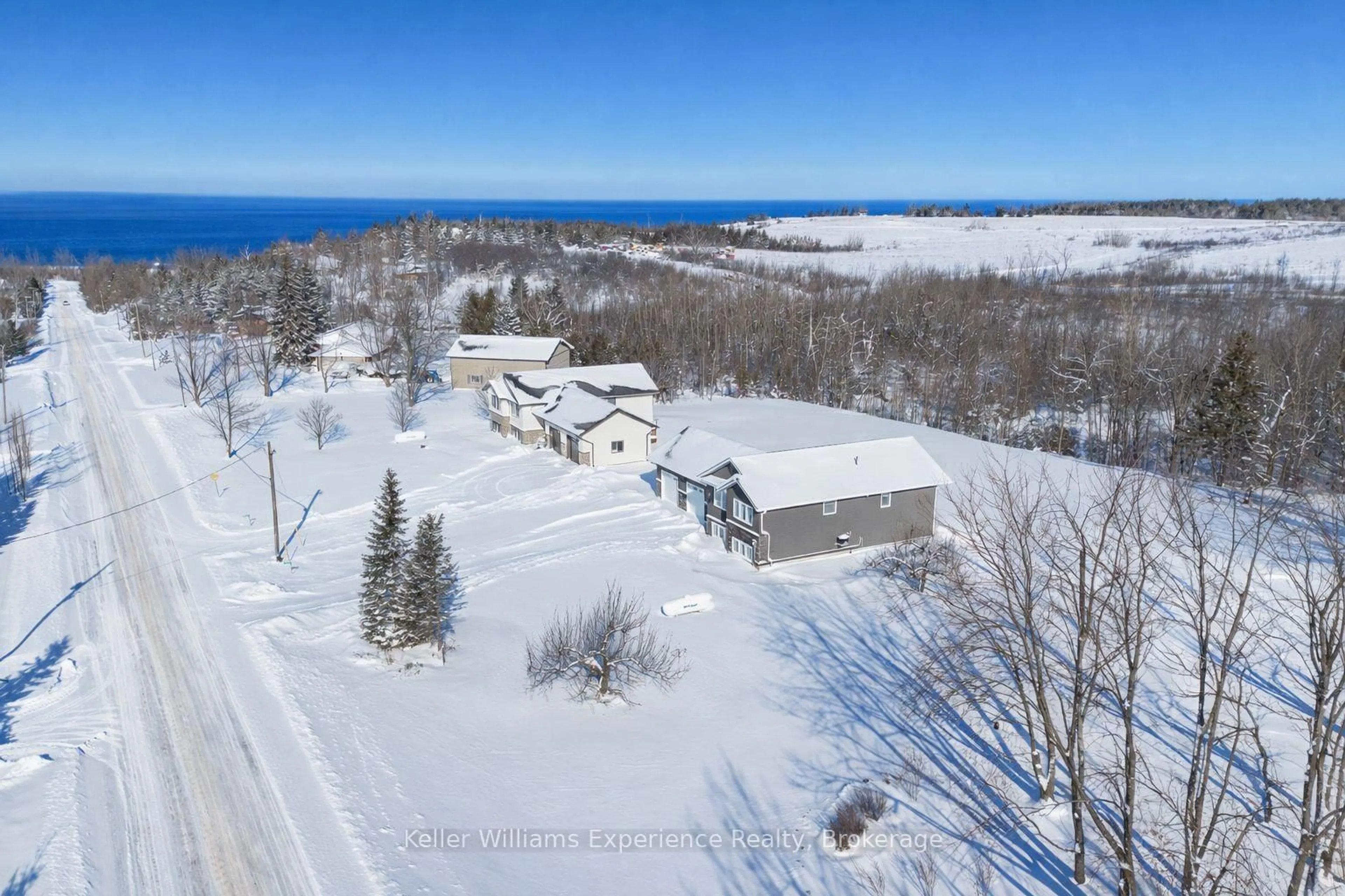 A pic from outside/outdoor area/front of a property/back of a property/a pic from drone, water/lake/river/ocean view for 317557 3rd Line, Meaford Ontario N4L 1W7