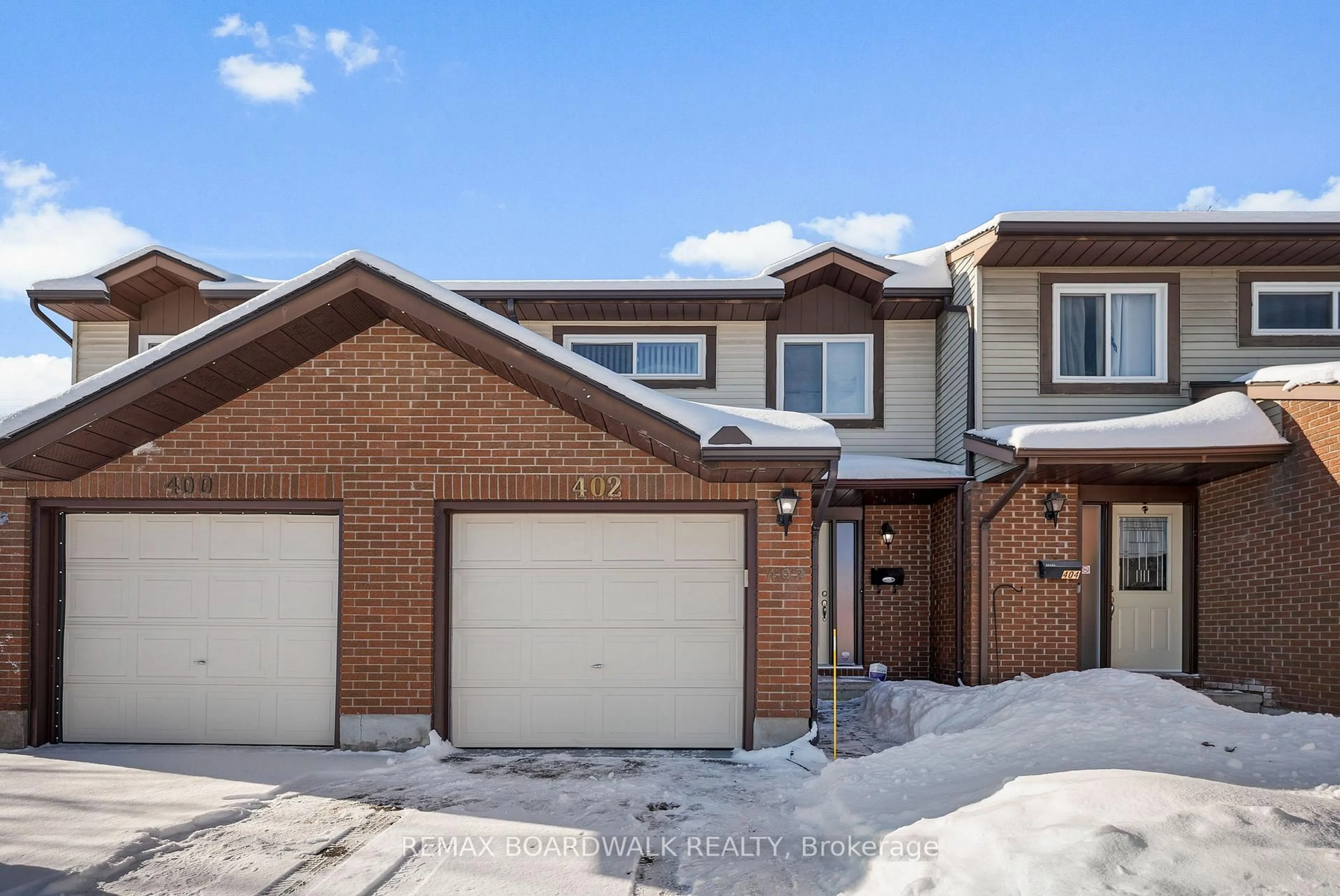 Home with brick exterior material, street for 402 Sandhamn Private, Ottawa Ontario K1T 2Y9