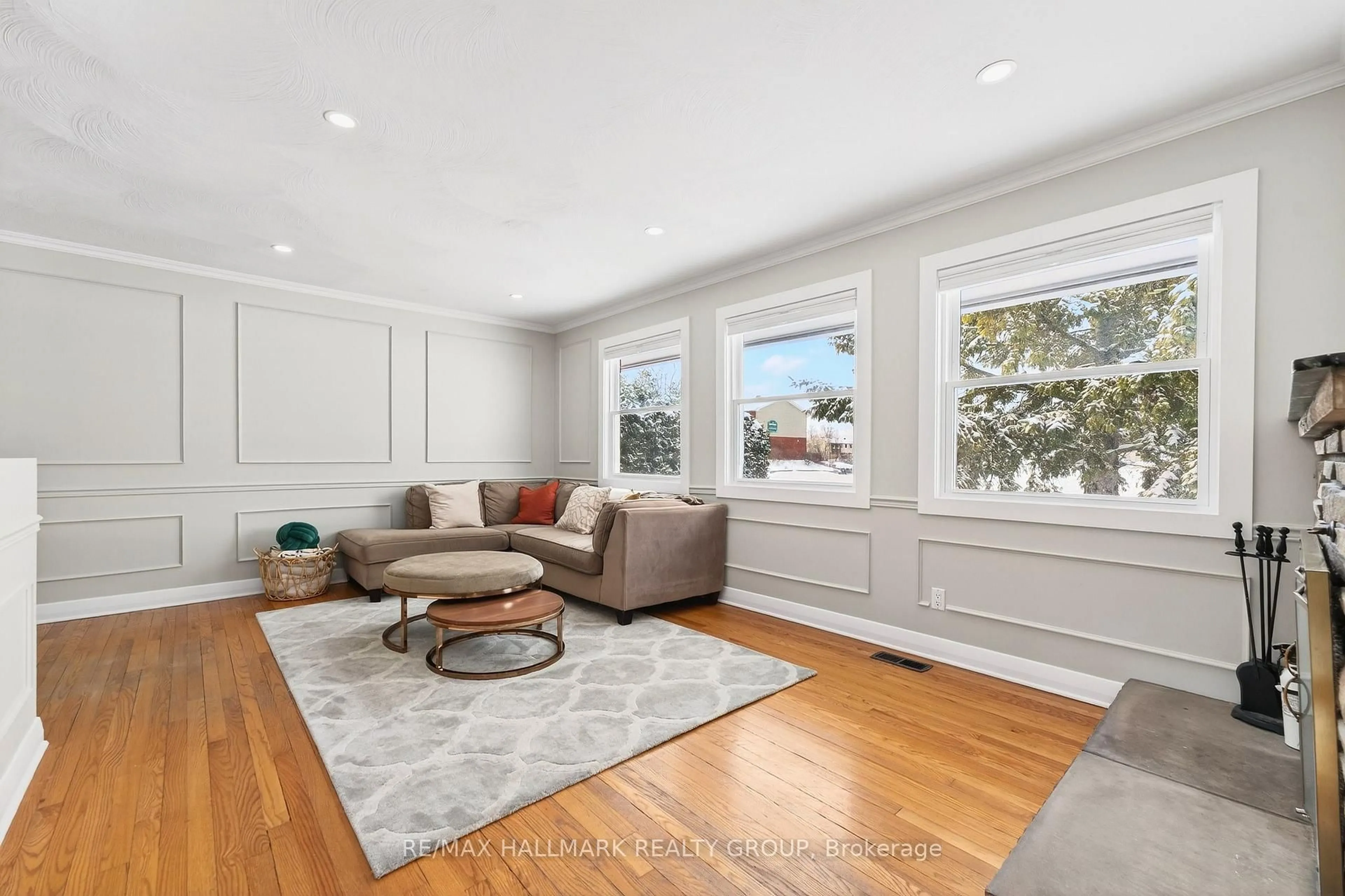 Living room with furniture, wood/laminate floor for 48 Knoxdale Rd, Ottawa Ontario K2G 1A3