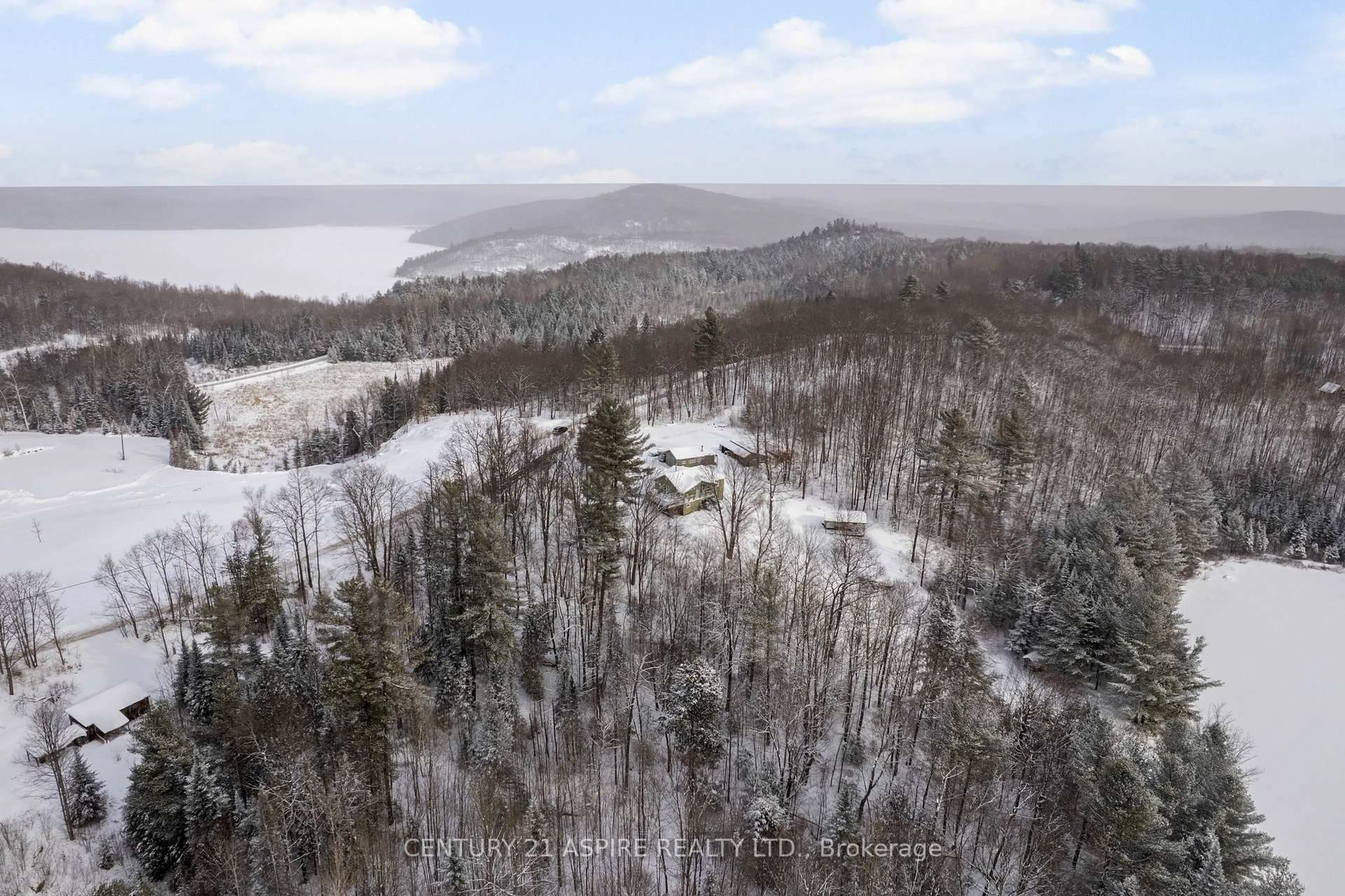 A pic from outside/outdoor area/front of a property/back of a property/a pic from drone, forest/trees view for 72 Maplewood Rd, Combermere Ontario K0J 1L0