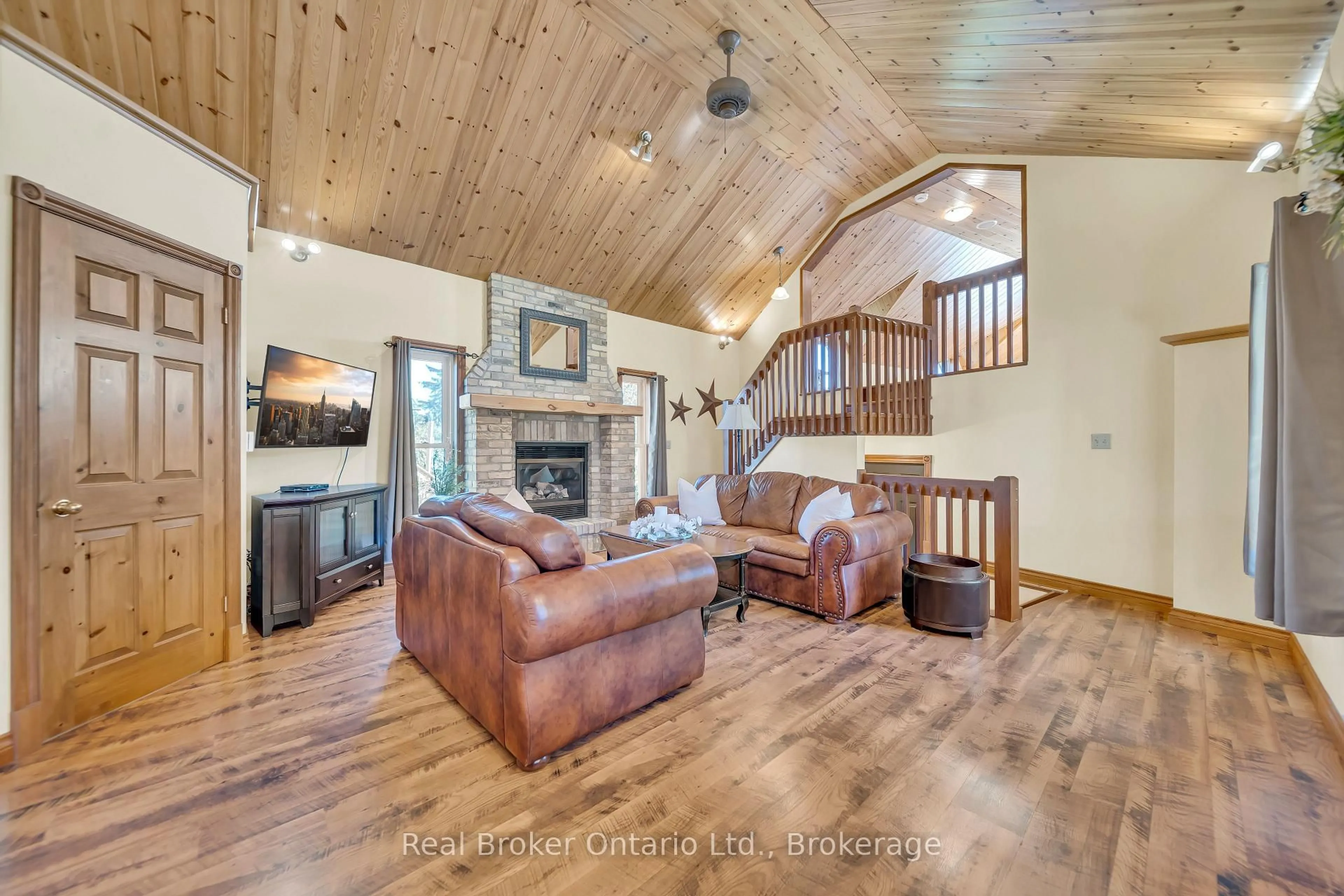 Living room with furniture, wood/laminate floor for 690 Wallace Ave, North Perth Ontario N4W 1Y4