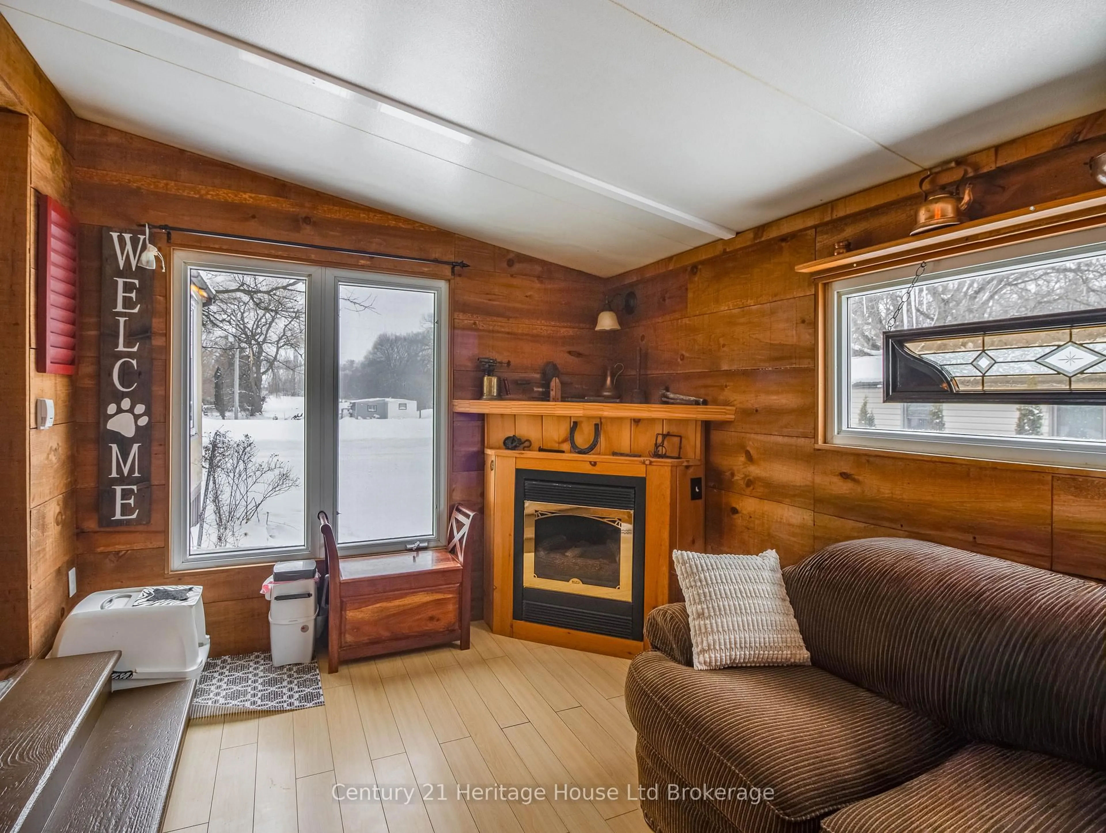 Living room with furniture, wood/laminate floor for 596101 Highway 59 #4 Tropicana Cres, East Zorra-Tavistock Ontario N4S 7W1