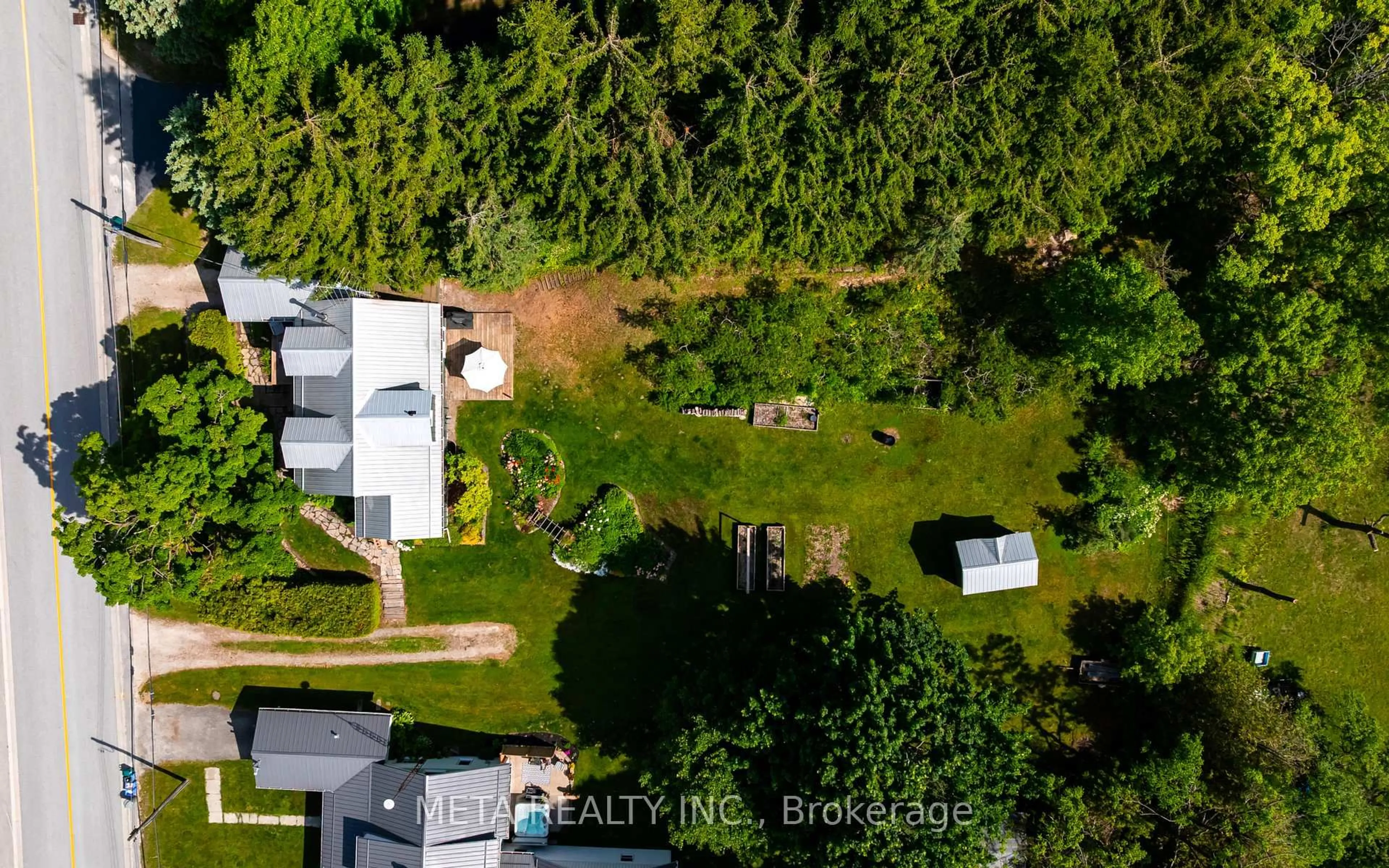 A pic from outside/outdoor area/front of a property/back of a property/a pic from drone, forest/trees view for 237 Main St, Melancthon Ontario L9V 1X7
