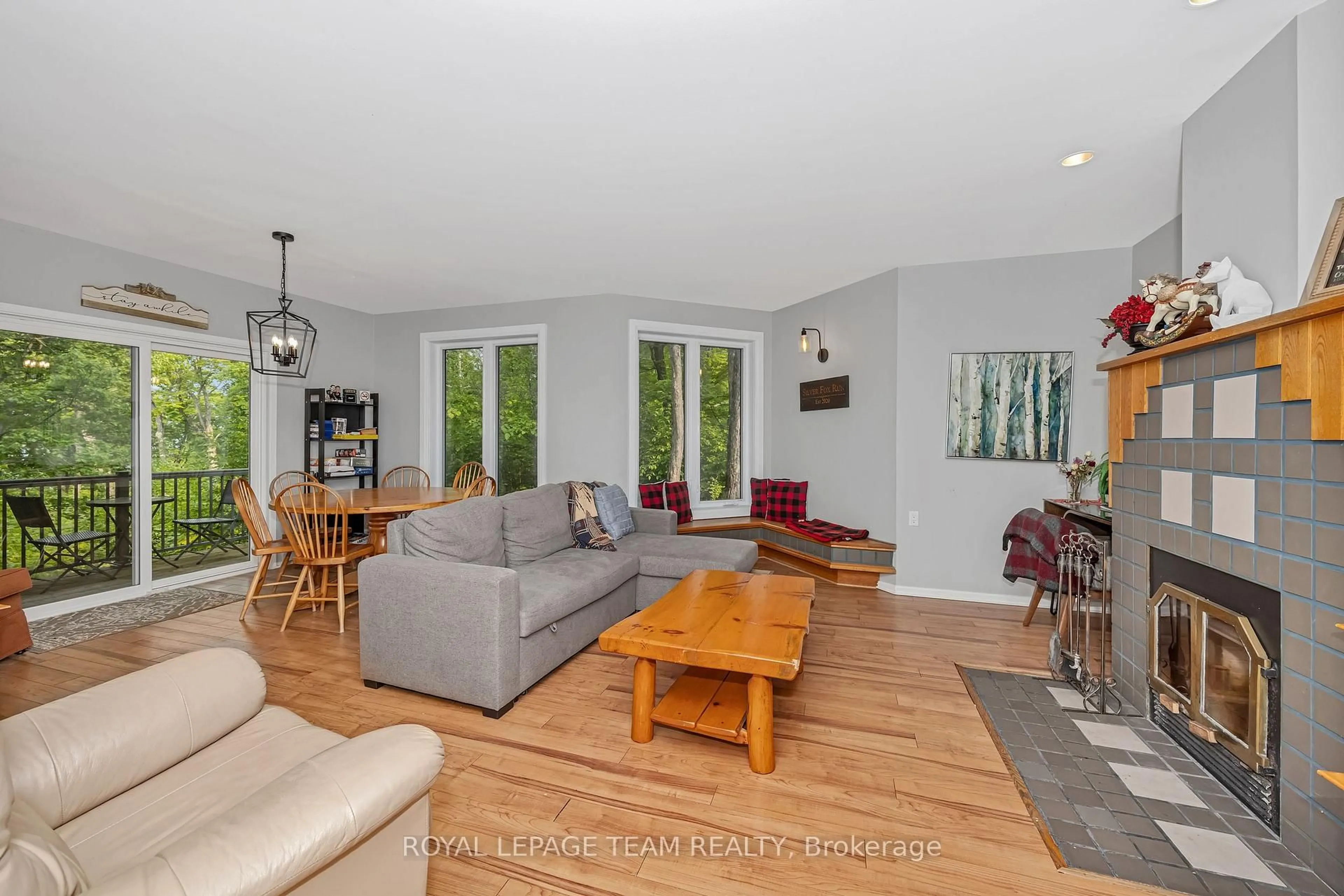 Living room with furniture, wood/laminate floor for 65 Mary Joanne Dr #203, Calabogie Ontario K0J 1H0