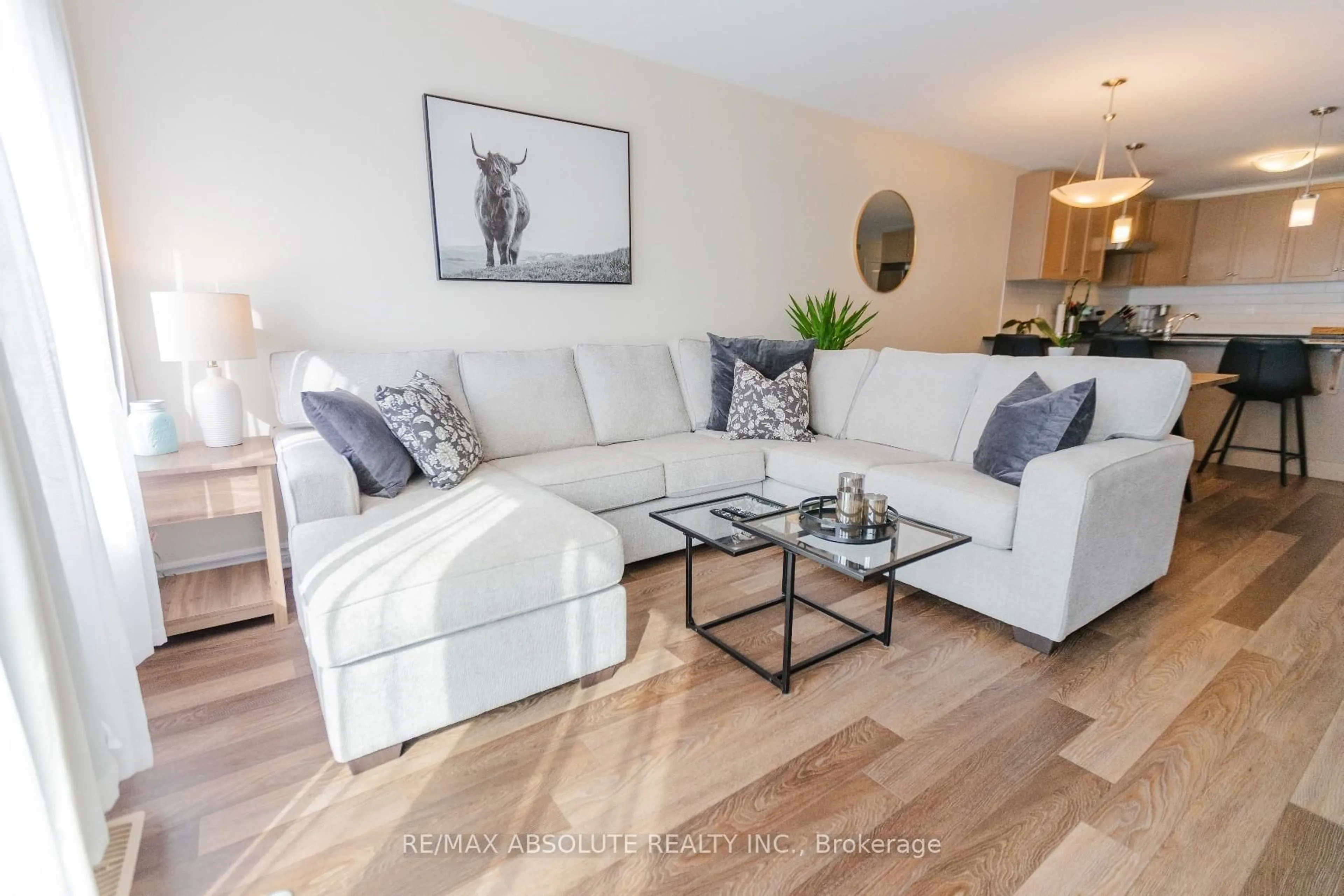 Living room with furniture, wood/laminate floor for 971 LEISHMAN Dr, Almonte Ontario K0A 1A0