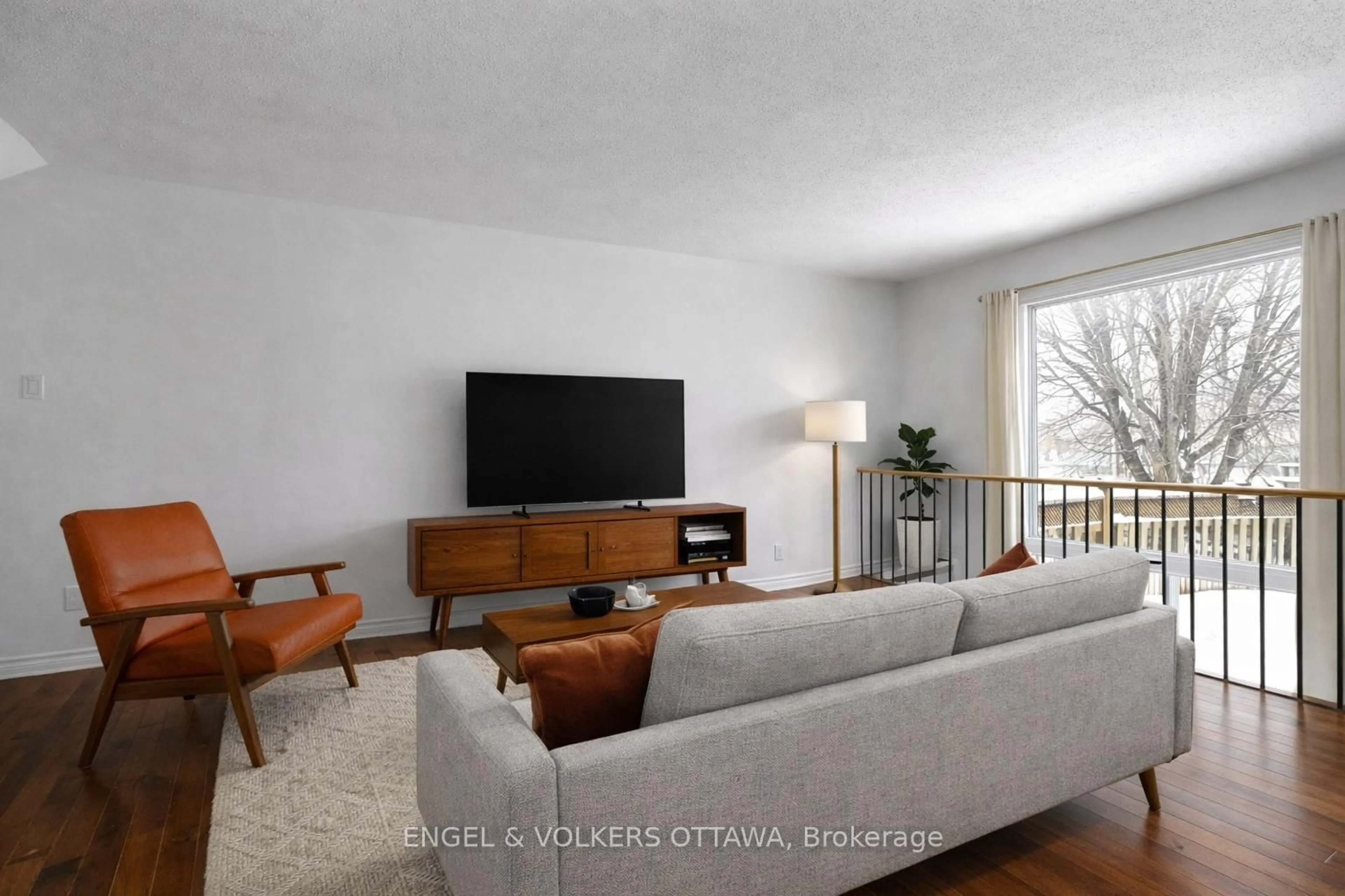 Living room with furniture, wood/laminate floor for 101 Halley St, Ottawa Ontario K2J 3R4
