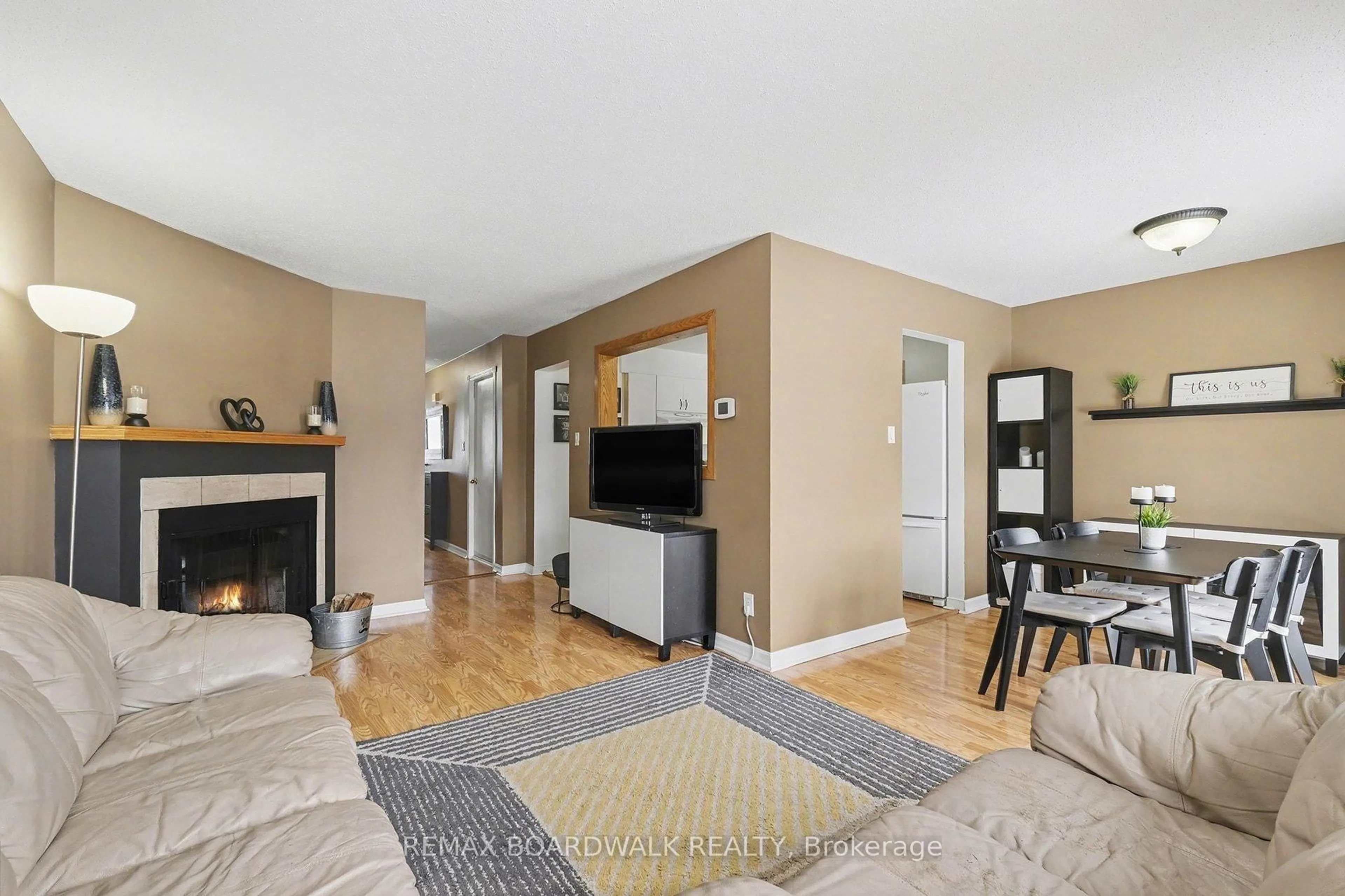 Living room with furniture, wood/laminate floor for 448 Valade Cres, Ottawa Ontario K4A 2W4