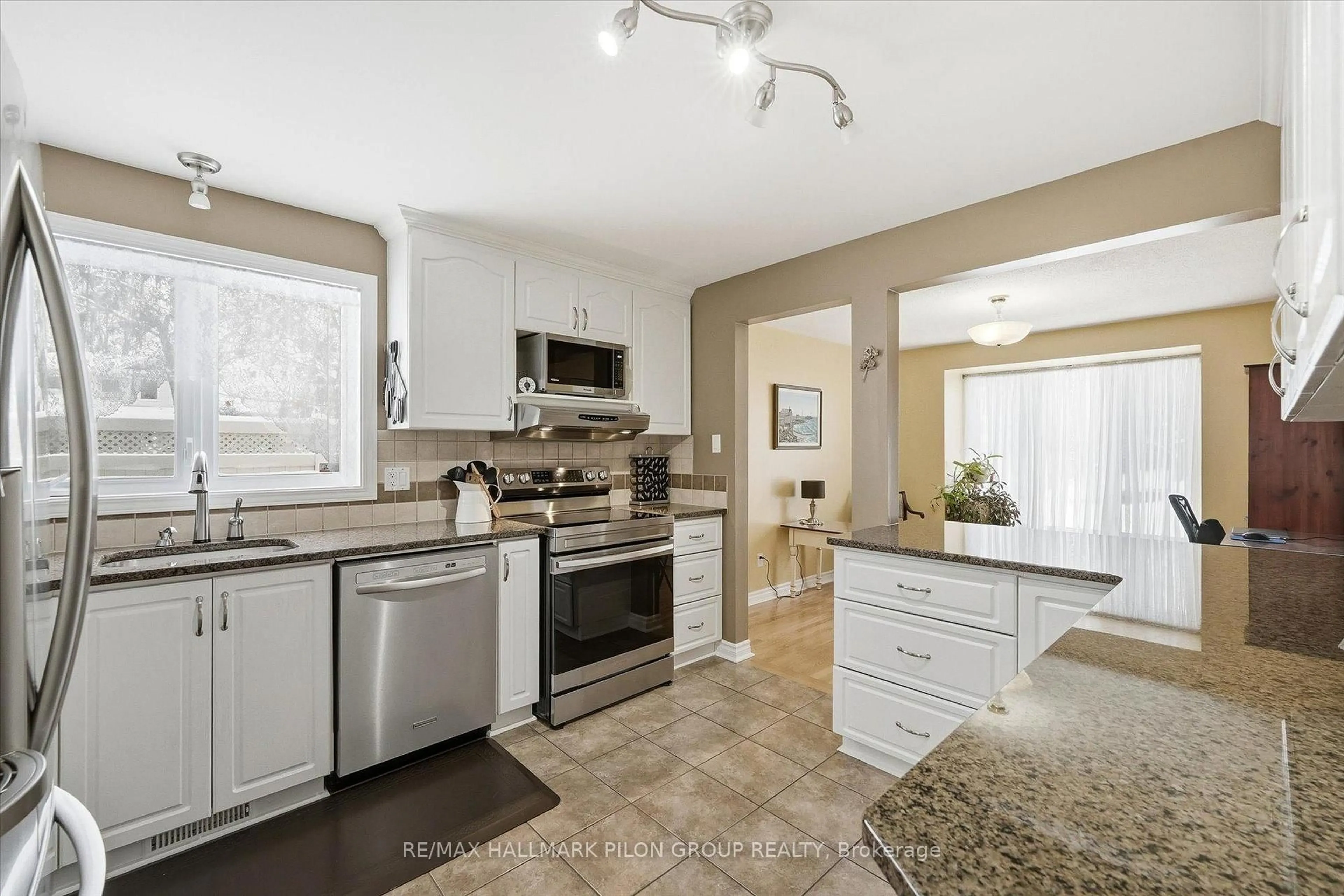 Open concept kitchen, ceramic/tile floor for 6093 Des Treflieres Gdns, Ottawa Ontario K1C 5T6