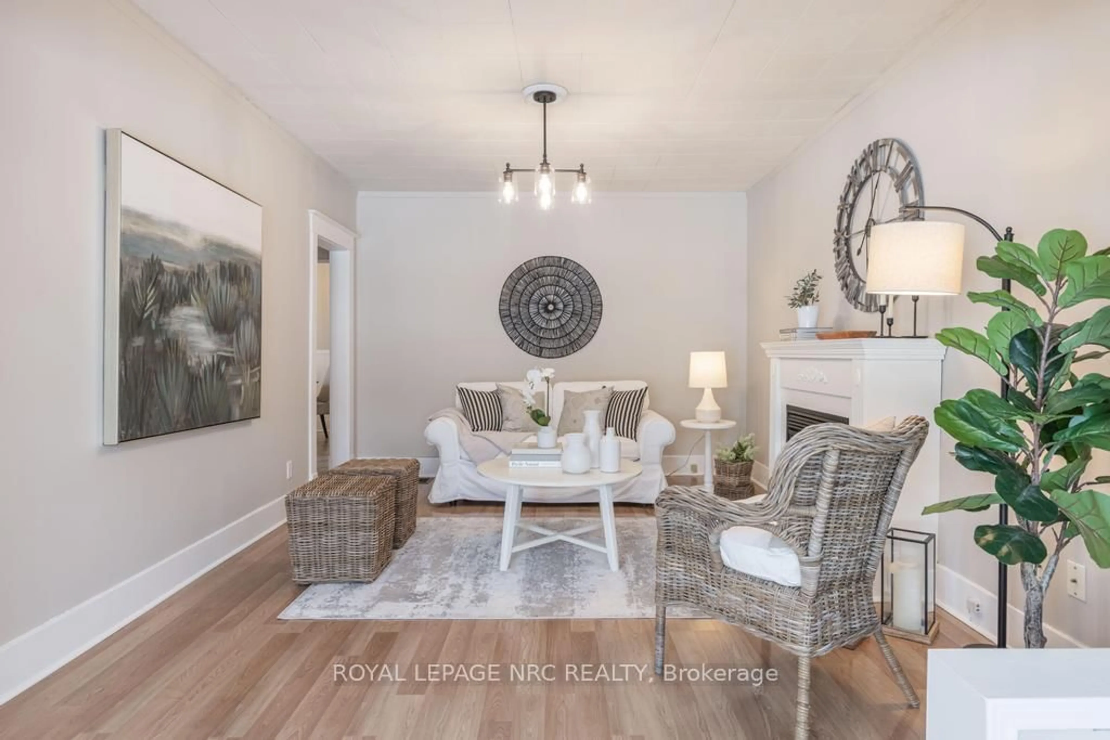 Living room with furniture, wood/laminate floor for 23 Trapnell St, St. Catharines Ontario L2R 1B1