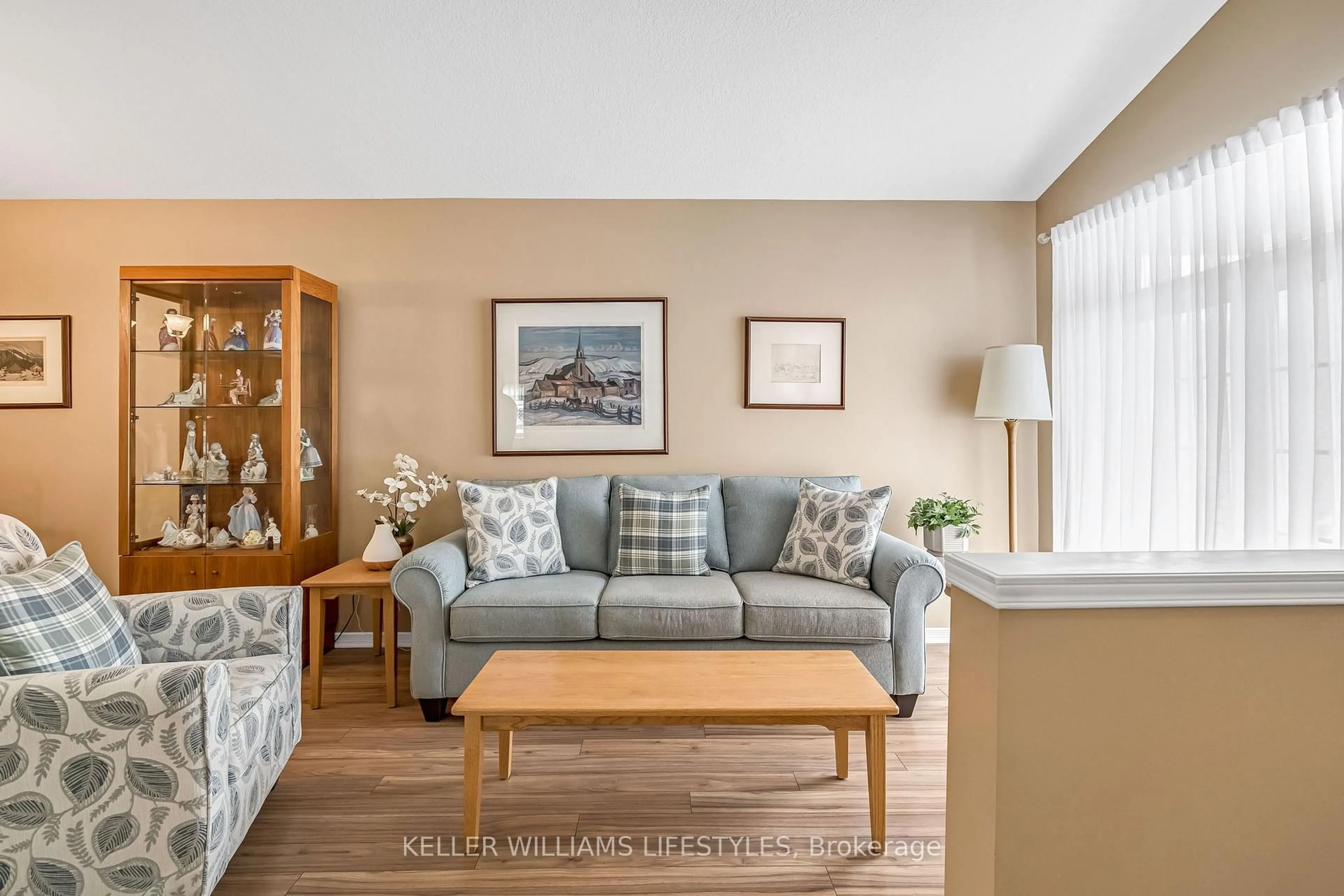 Living room with furniture, wood/laminate floor for 1423 South Wenige Dr, London North Ontario N5X 4N1