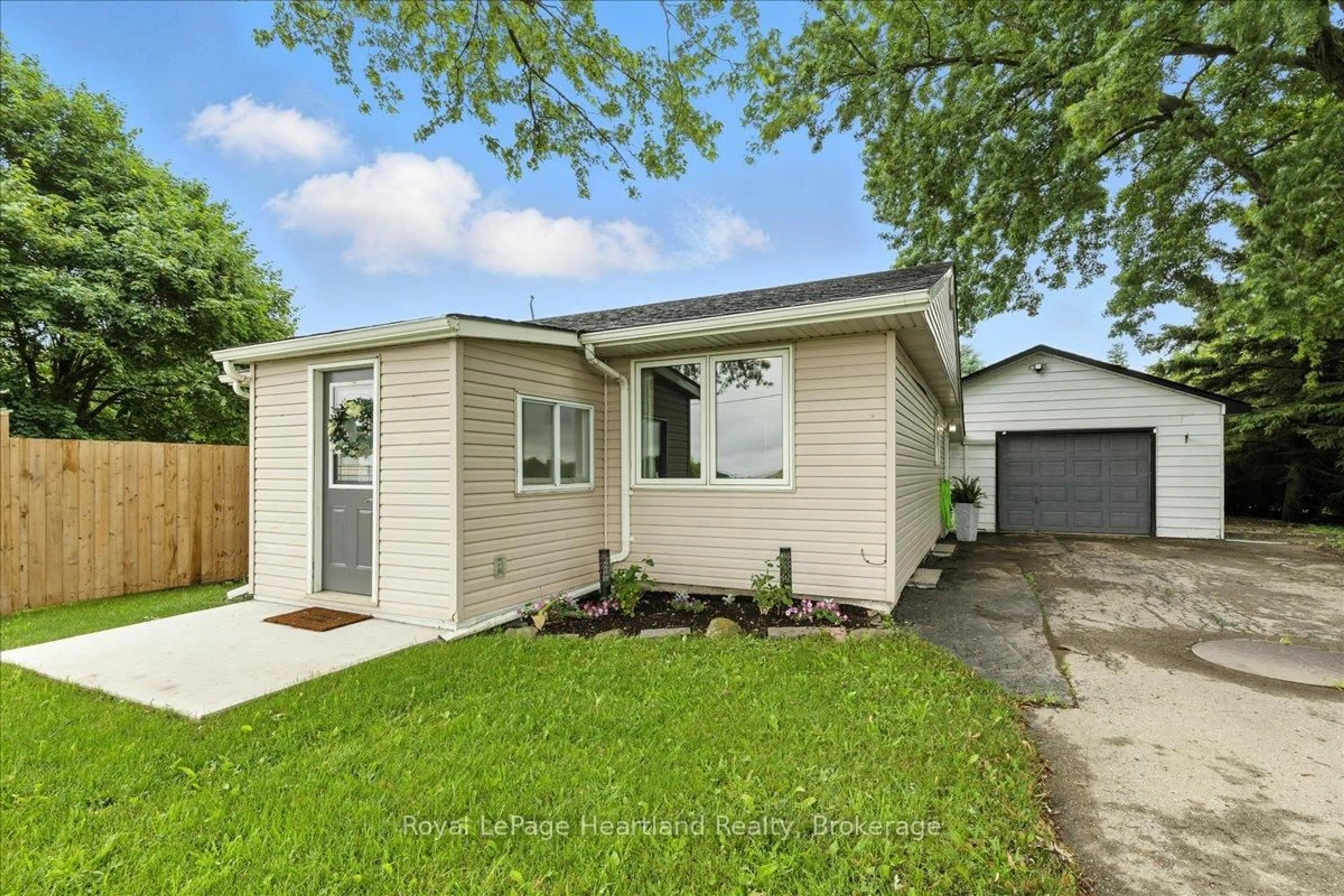 Home with vinyl exterior material, street for 7637 Wellington Road 7, Mapleton Ontario N0B 1A0