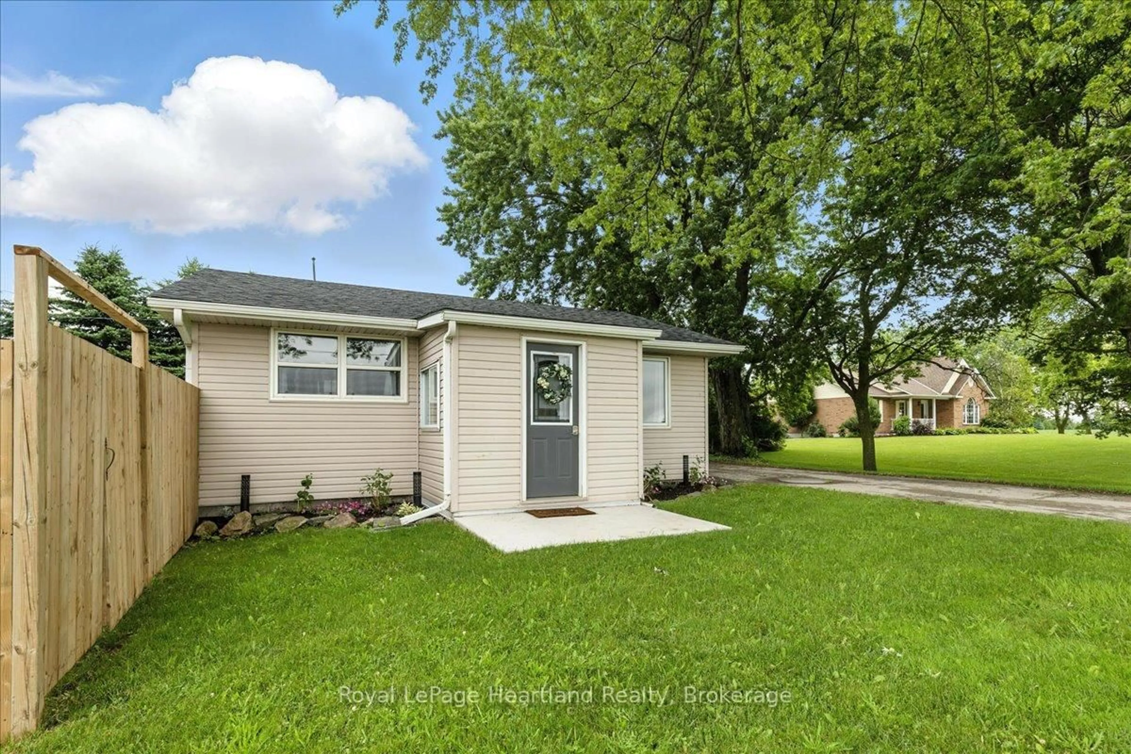 Home with vinyl exterior material, street for 7637 Wellington Road 7, Mapleton Ontario N0B 1A0