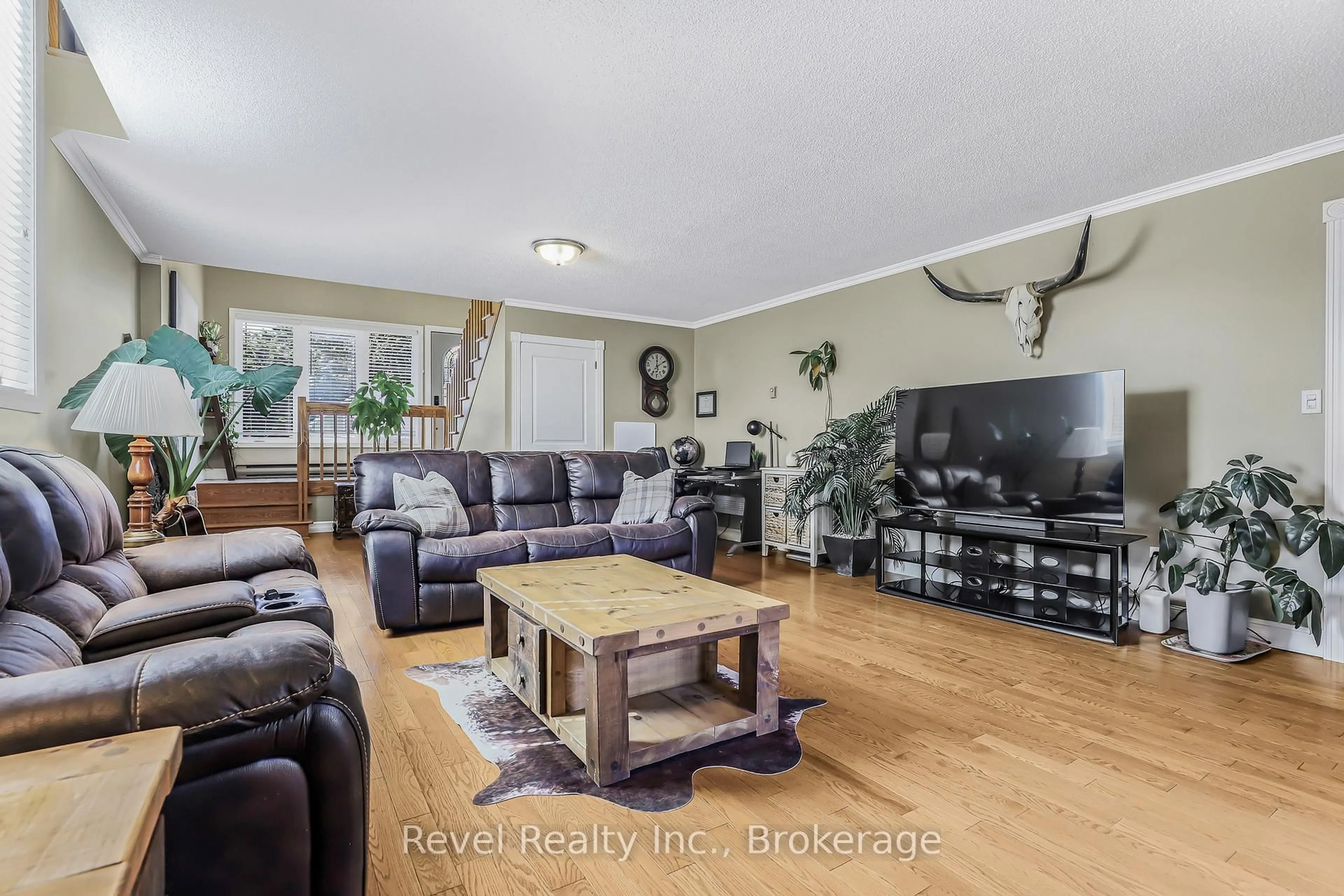Living room with furniture, wood/laminate floor for 786 8th St, Owen Sound Ontario N4K 1L9