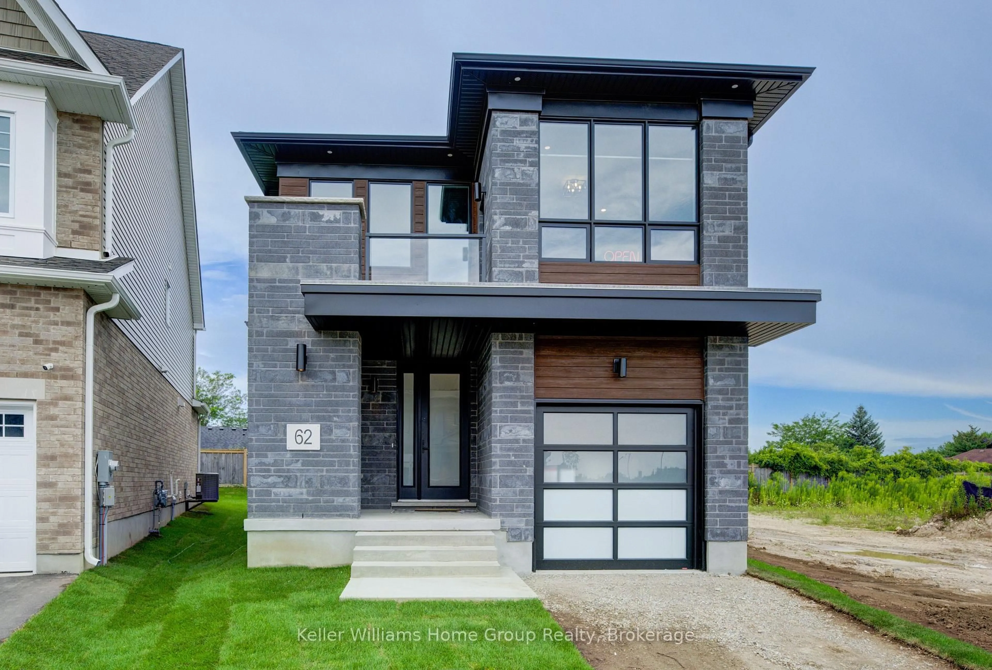 Home with brick exterior material, street for 62 Lovett Lane, Guelph Ontario N1G 0H3