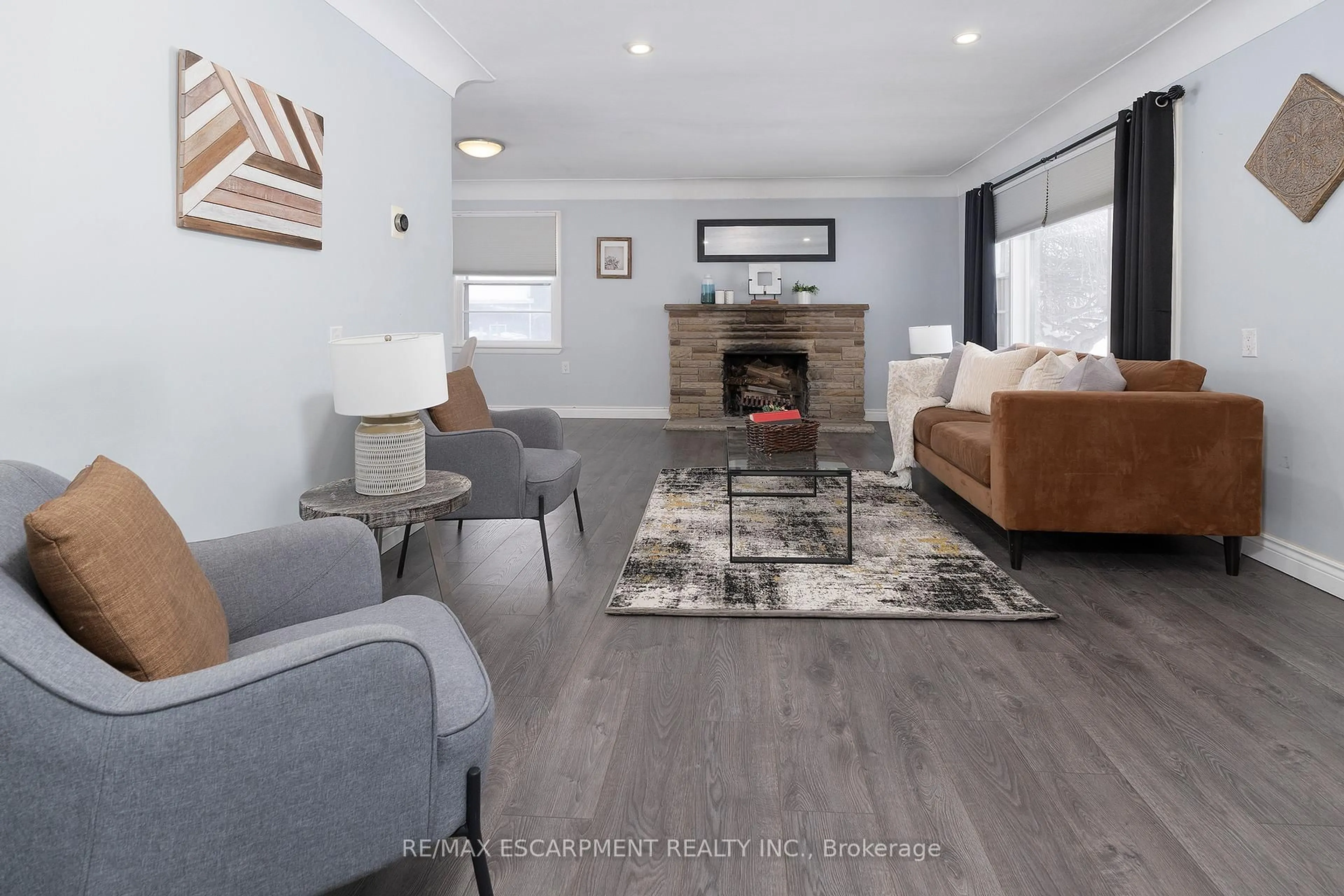 Living room with furniture, wood/laminate floor for 2448 Wilson St, Hamilton Ontario L0R 1R0