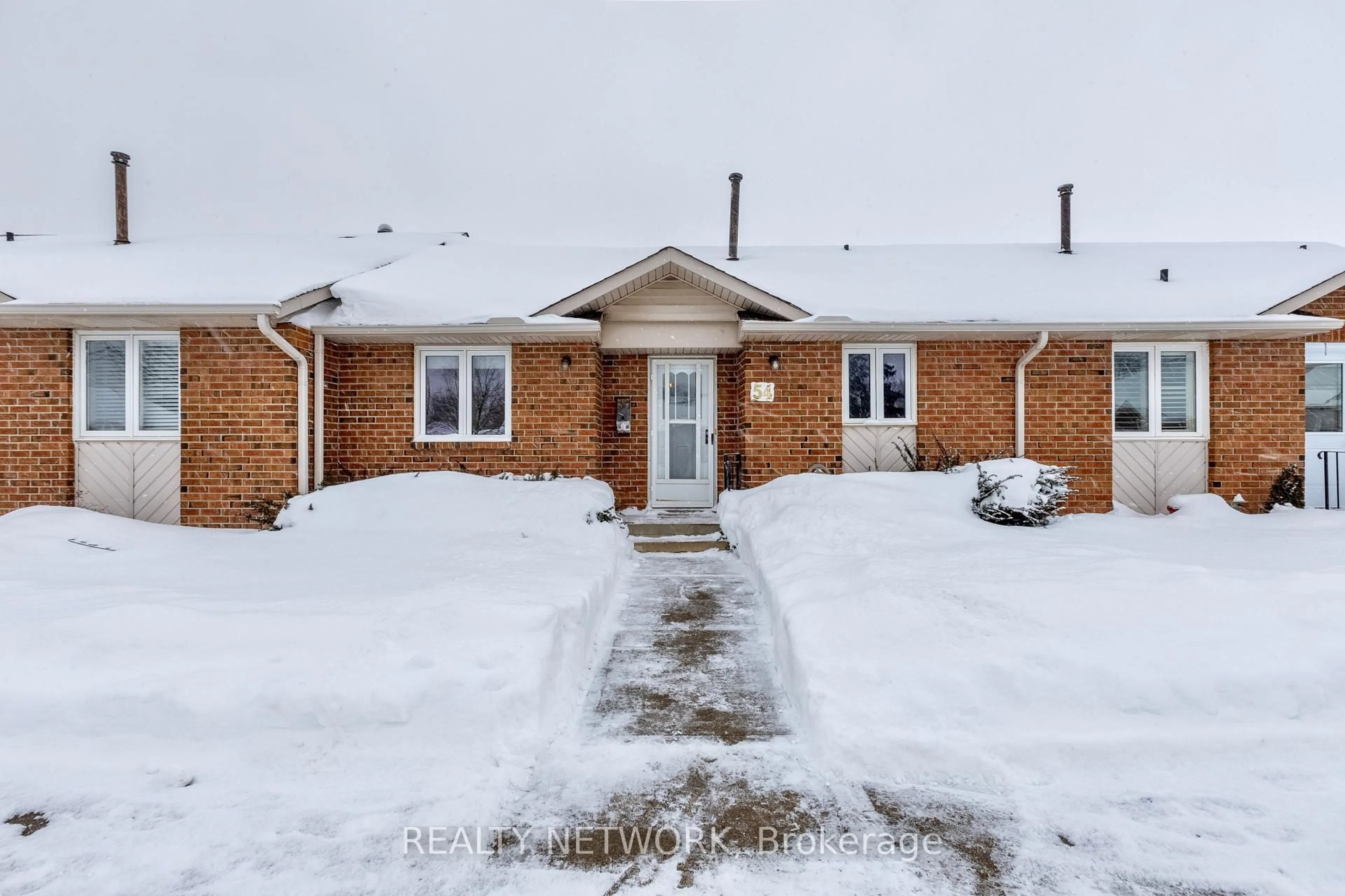 A pic from outside/outdoor area/front of a property/back of a property/a pic from drone, street for 122 Bunting Rd #54, St. Catharines Ontario L2P 3X7