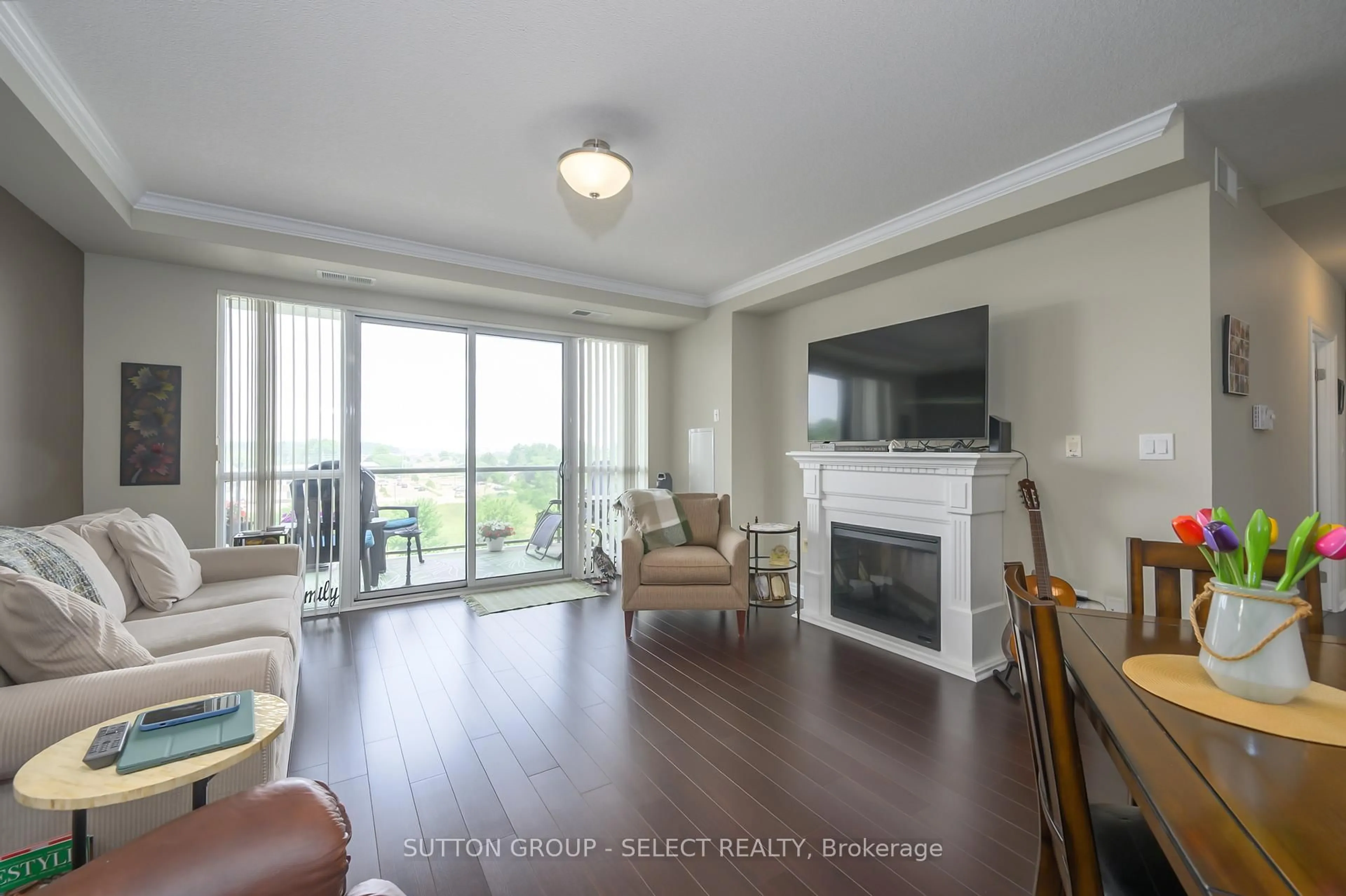 Living room with furniture, wood/laminate floor for 1030 CORONATION Dr #606, London North Ontario N6G 0G5
