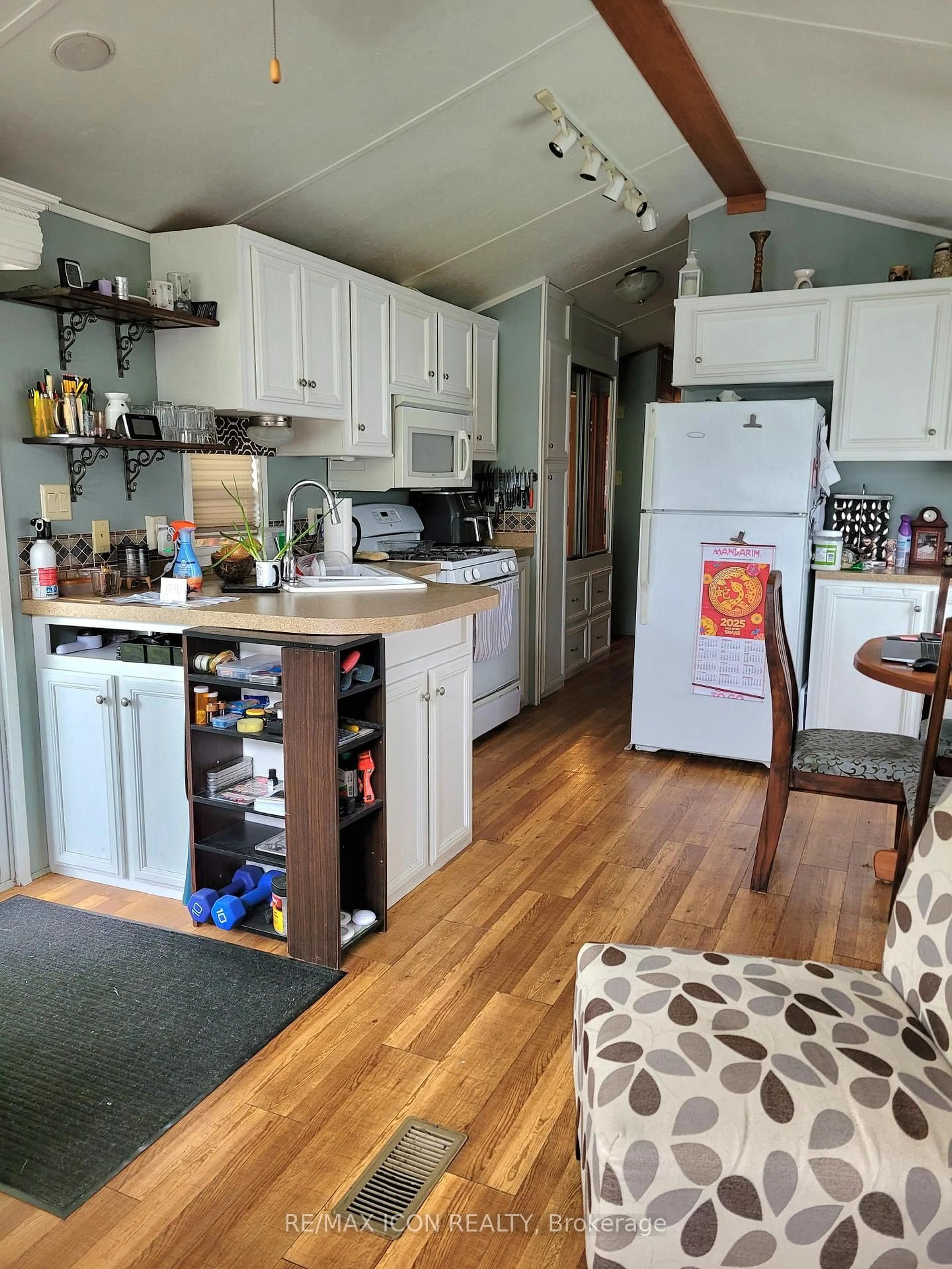 Open concept kitchen, wood/laminate floor for 77719 Bluewater Highway #41 Portside Dr, Bluewater Ontario N0M 1G0