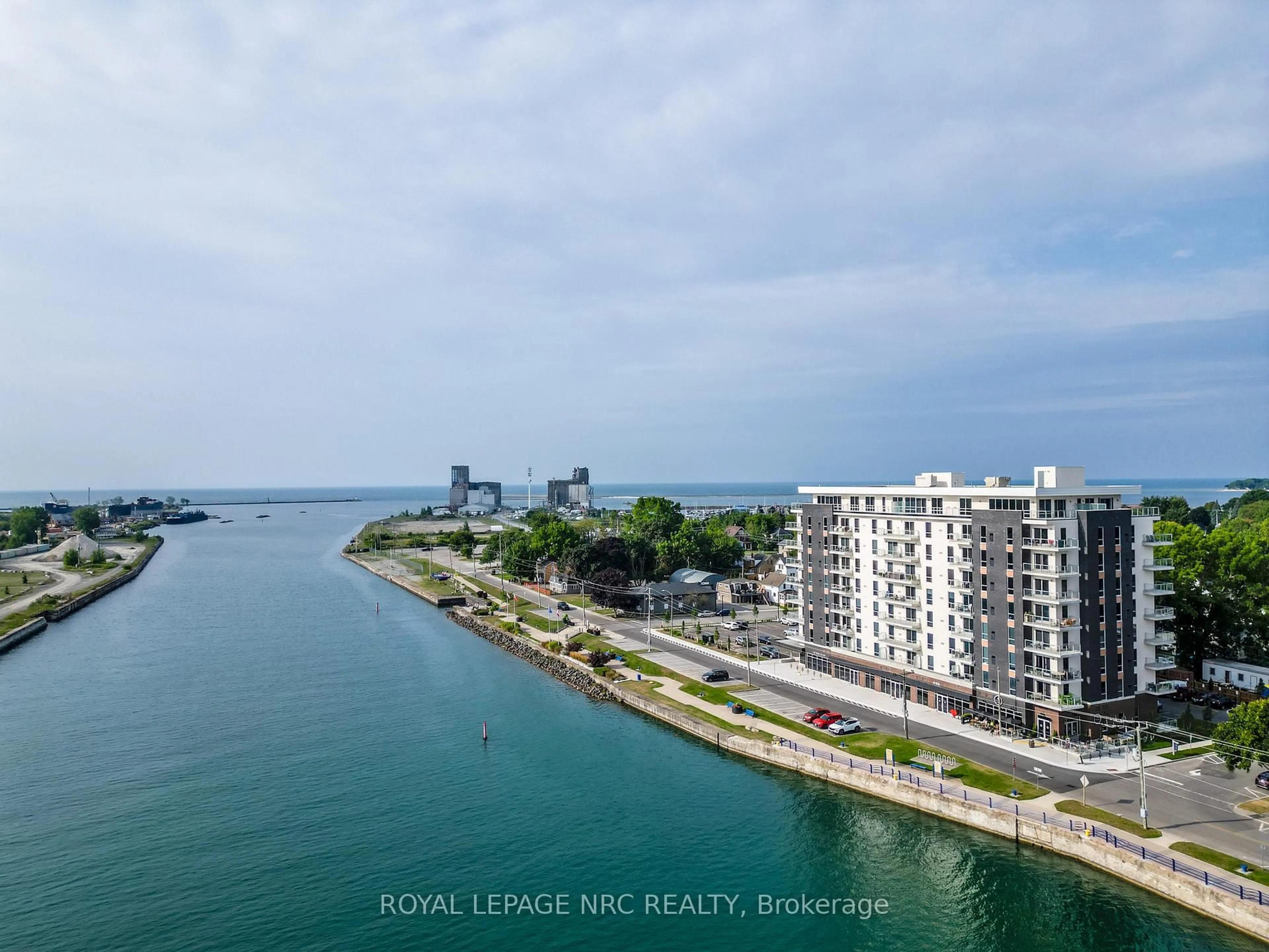 A pic from outside/outdoor area/front of a property/back of a property/a pic from drone, water/lake/river/ocean view for 118 West St #204, Port Colborne Ontario L3K 0B9
