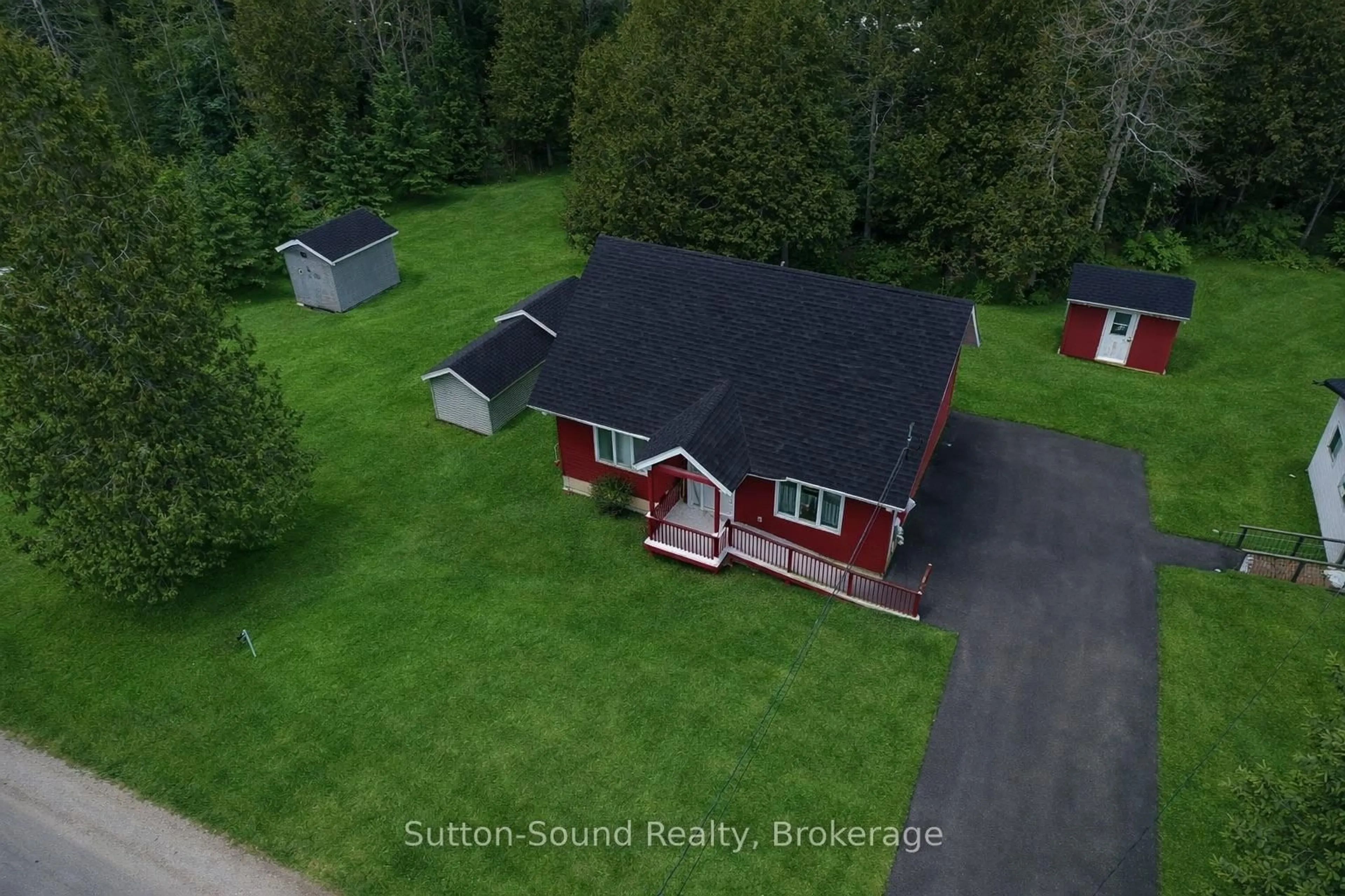 A pic from outside/outdoor area/front of a property/back of a property/a pic from drone, street for 554 Stokes Bay Rd, Northern Bruce Peninsula Ontario N0H 2M0