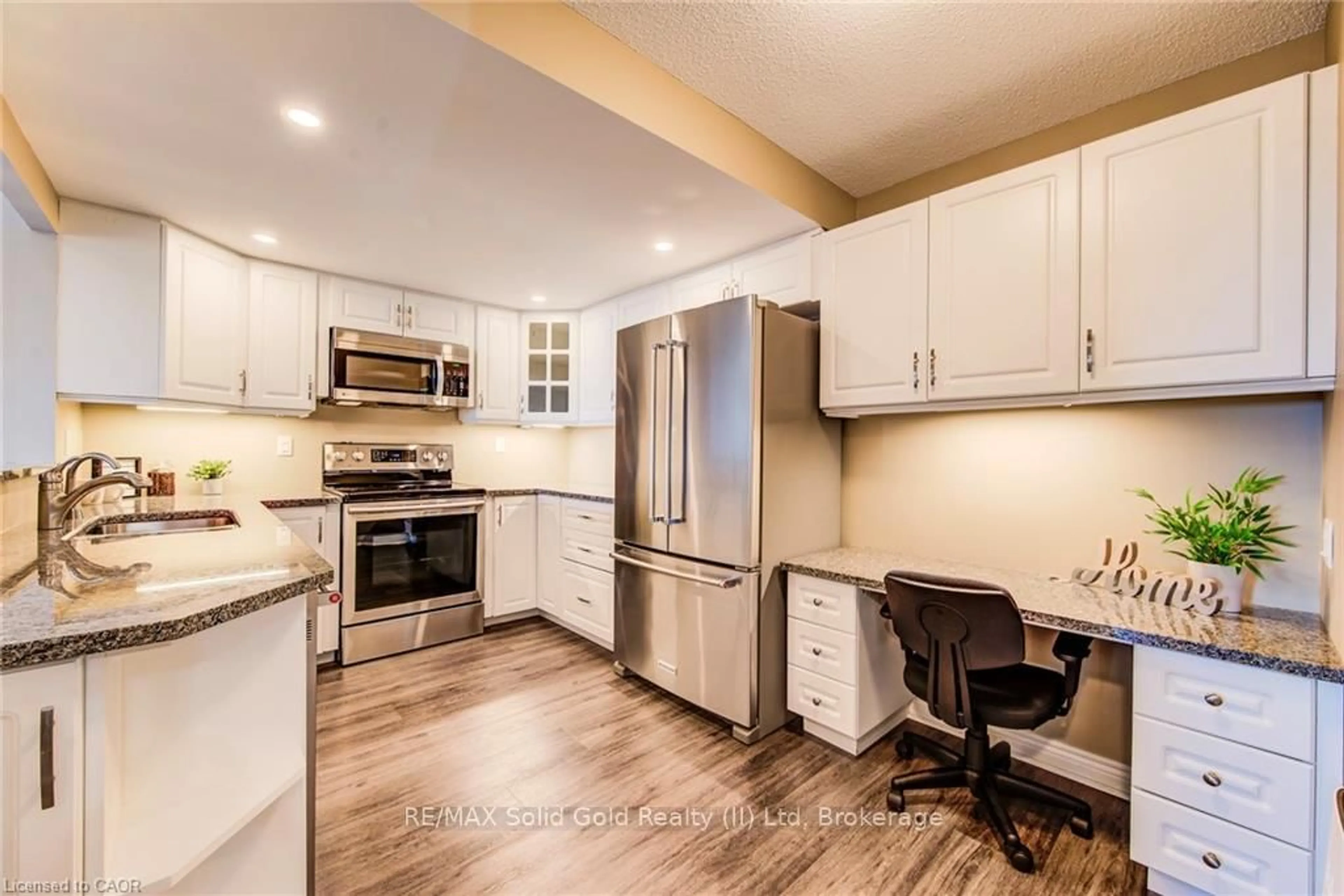 Open concept kitchen, wood/laminate floor for 6 Willow St #2203, Waterloo Ontario N2J 4S3