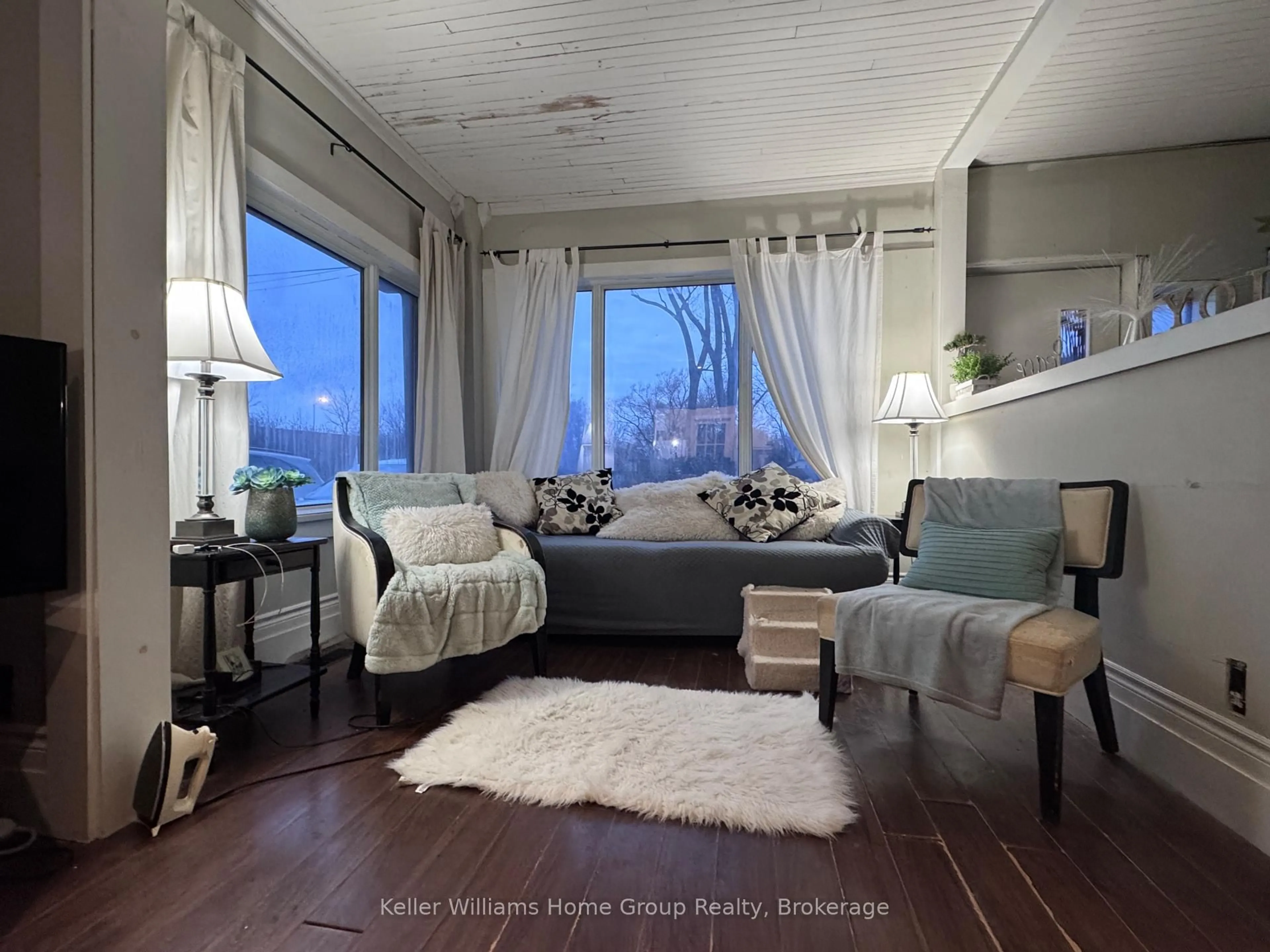 Living room with furniture, wood/laminate floor for 22 Clare Ave, Hamilton Ontario L8N 7X1