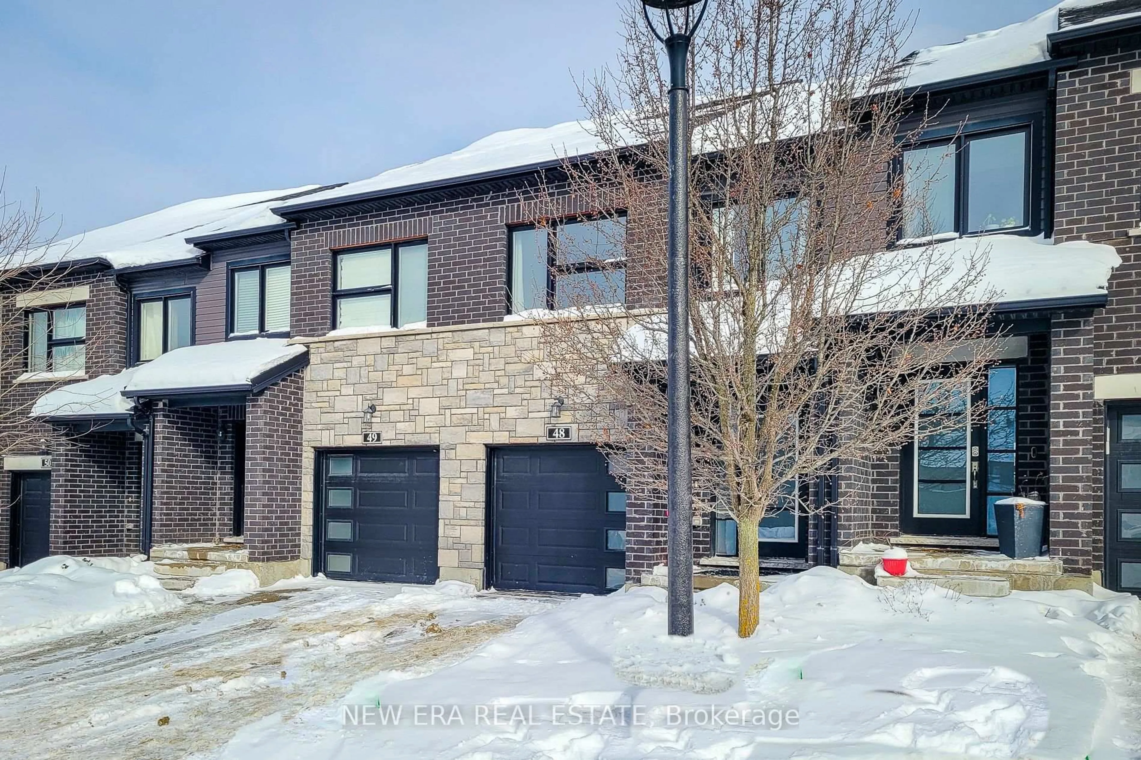 Home with brick exterior material, street for 91 Poppy Dr #48, Guelph Ontario N1L 0M6