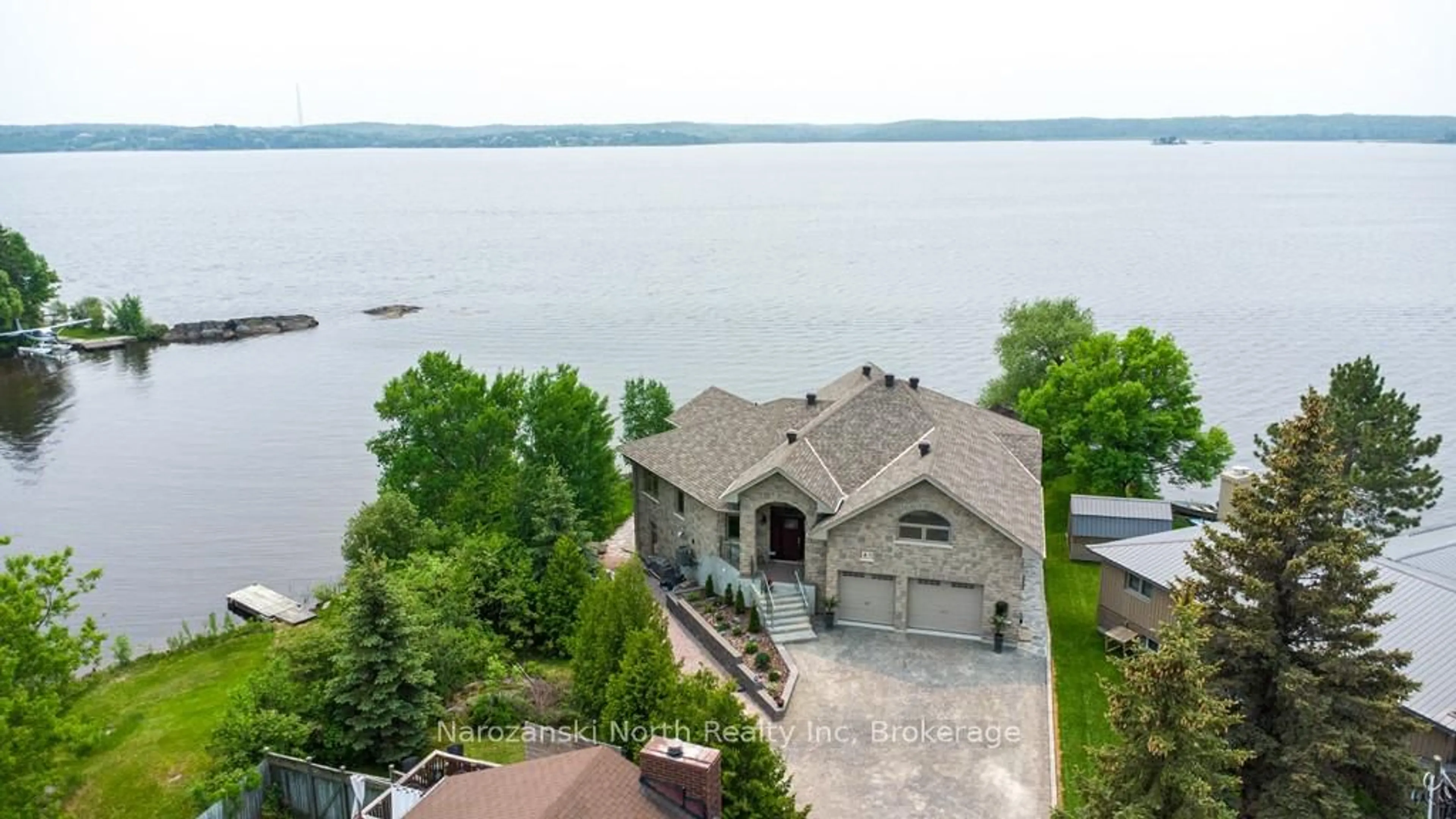 A pic from outside/outdoor area/front of a property/back of a property/a pic from drone, water/lake/river/ocean view for 8 Telesphore St, Greater Sudbury Ontario P0M 1B0
