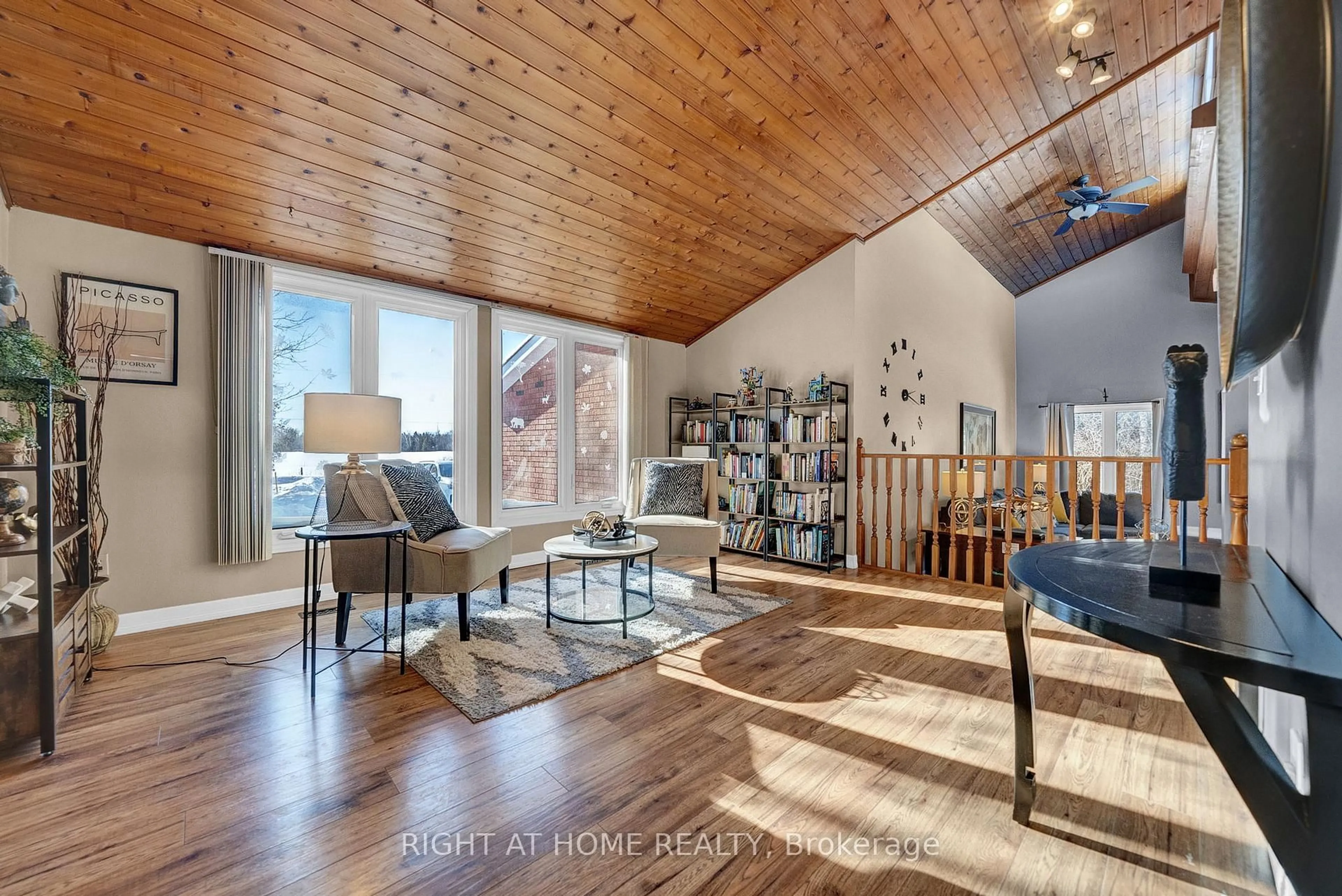 Living room with furniture, wood/laminate floor for 424 Bridle Rd, Kawartha Lakes Ontario K9V 4R2