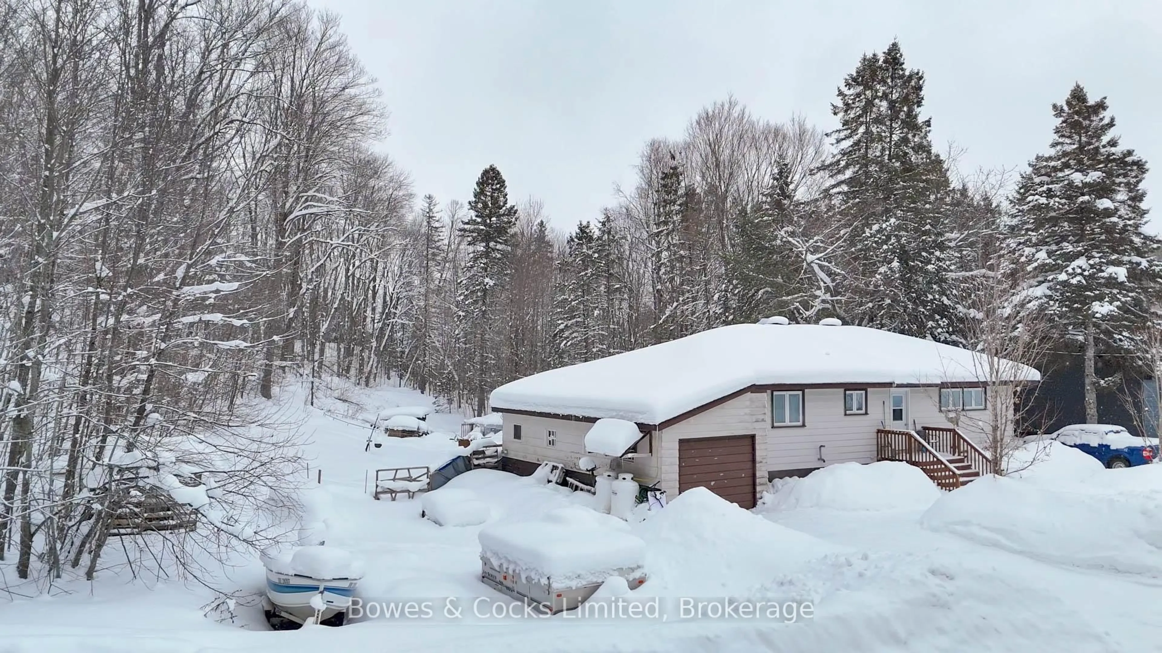 A pic from outside/outdoor area/front of a property/back of a property/a pic from drone, street for 1052 Estates Rd, Highlands East Ontario K0L 1C0