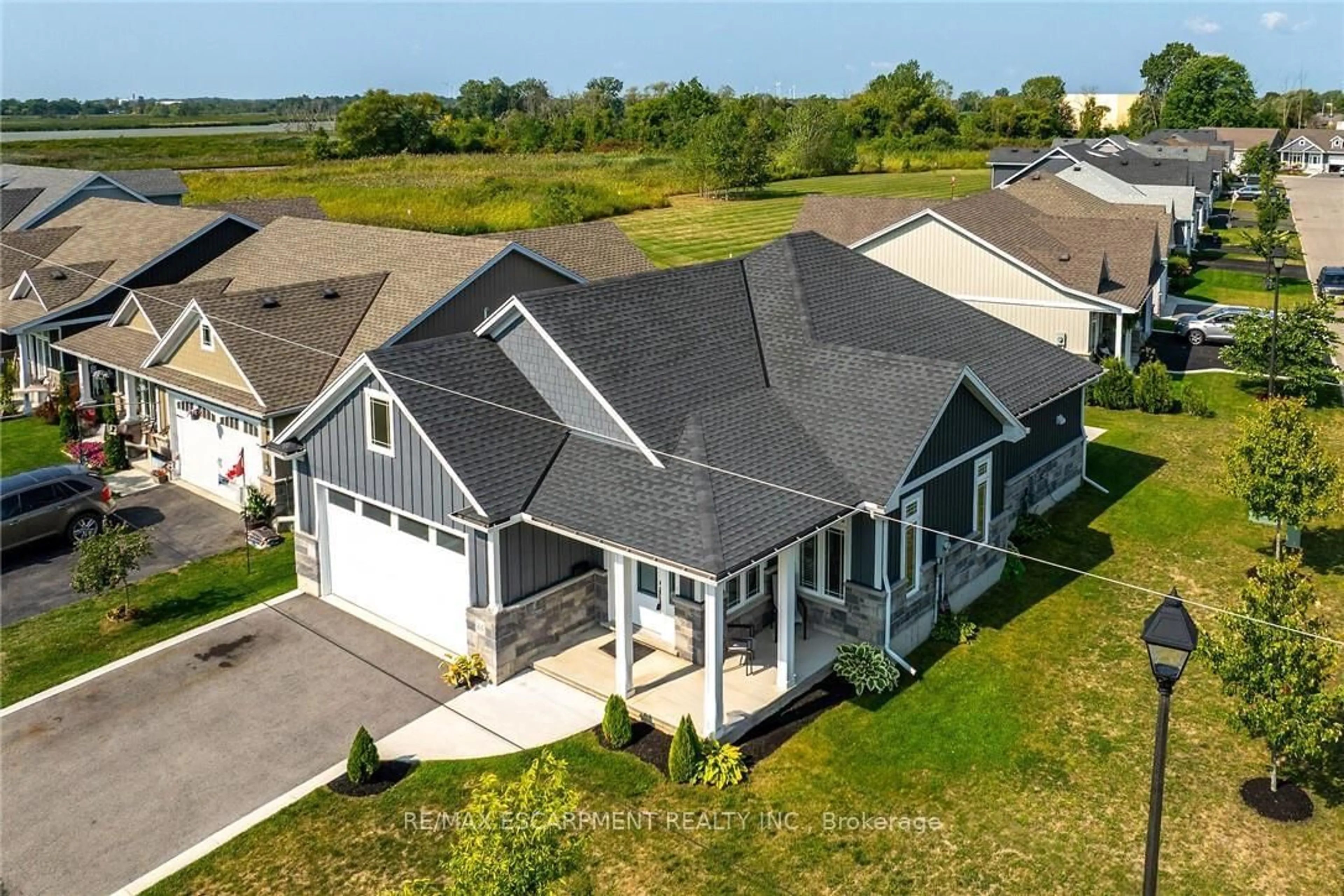 A pic from outside/outdoor area/front of a property/back of a property/a pic from drone, water/lake/river/ocean view for 740 Main St #24, Haldimand Ontario N1A 0B3