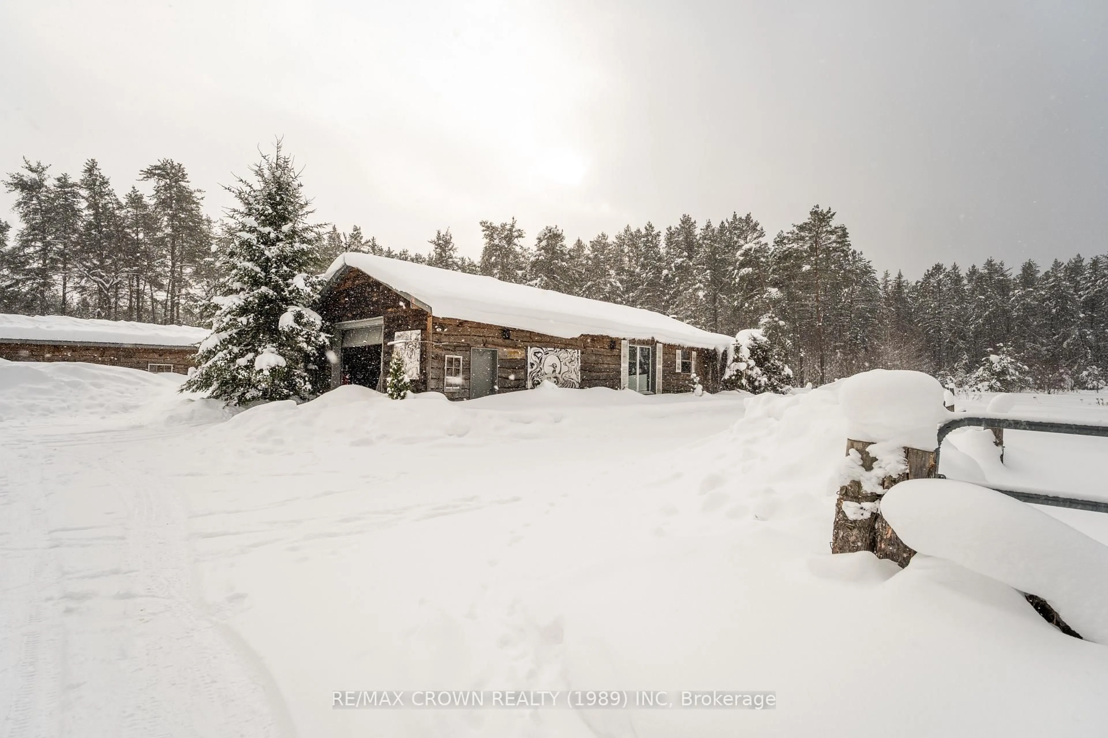 A pic from outside/outdoor area/front of a property/back of a property/a pic from drone, mountain view for 229 Airport Rd, Sundridge Ontario P0A 1Z0