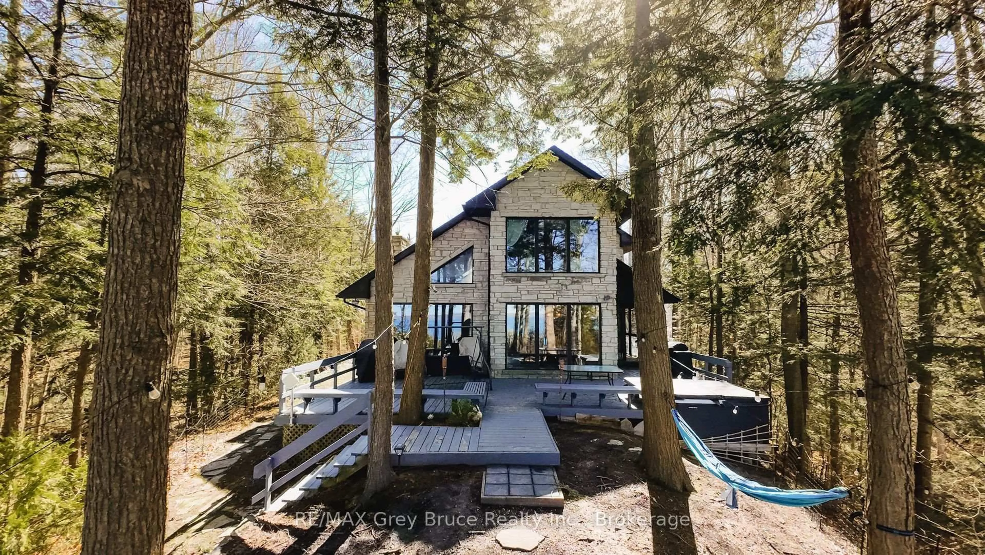A pic from outside/outdoor area/front of a property/back of a property/a pic from drone, forest/trees view for 128 Thornridge Rd, Meaford Ontario N0H 1B0