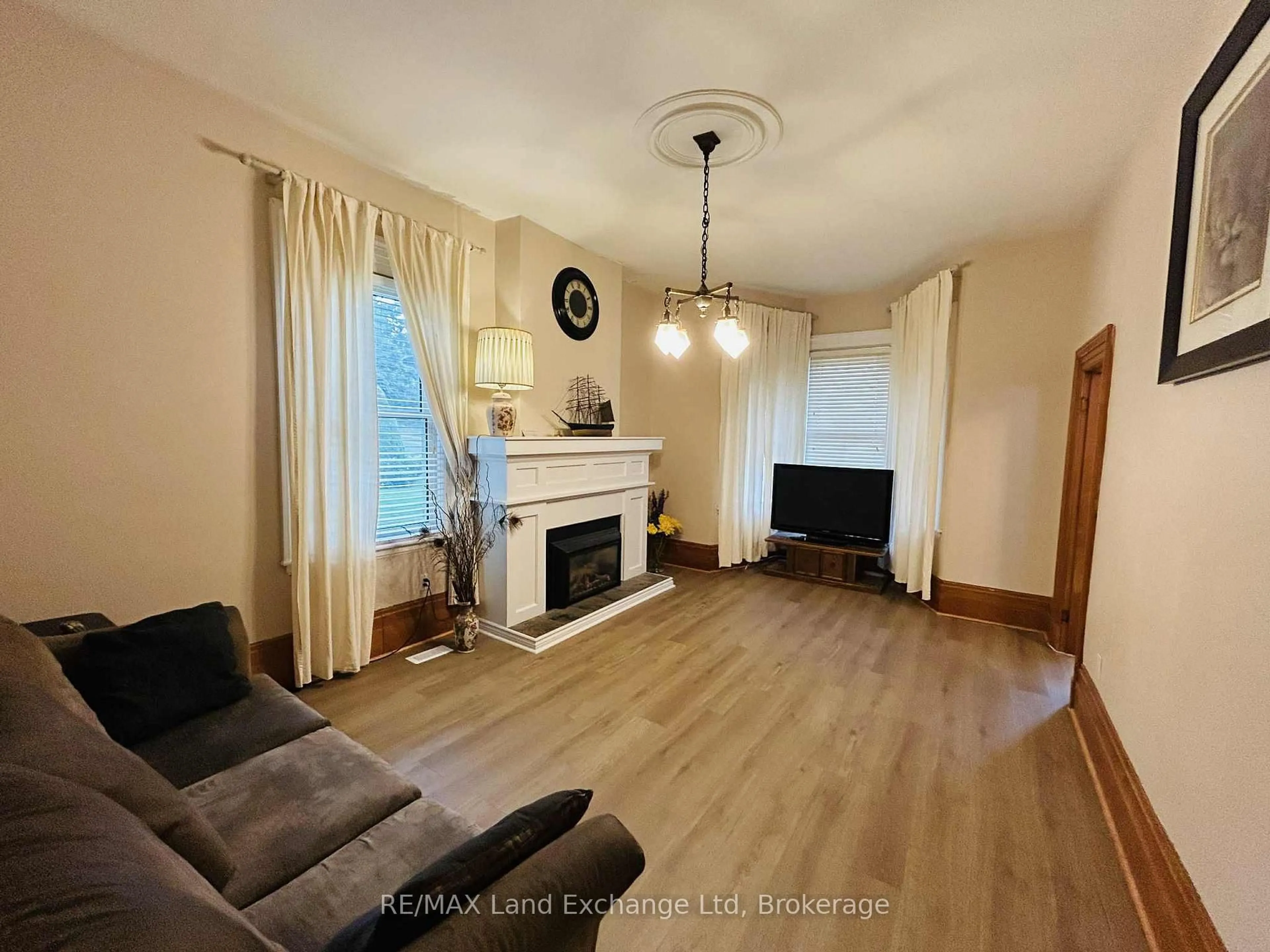 Living room with furniture, wood/laminate floor for 81 Patrick St, North Huron Ontario N0G 2W0
