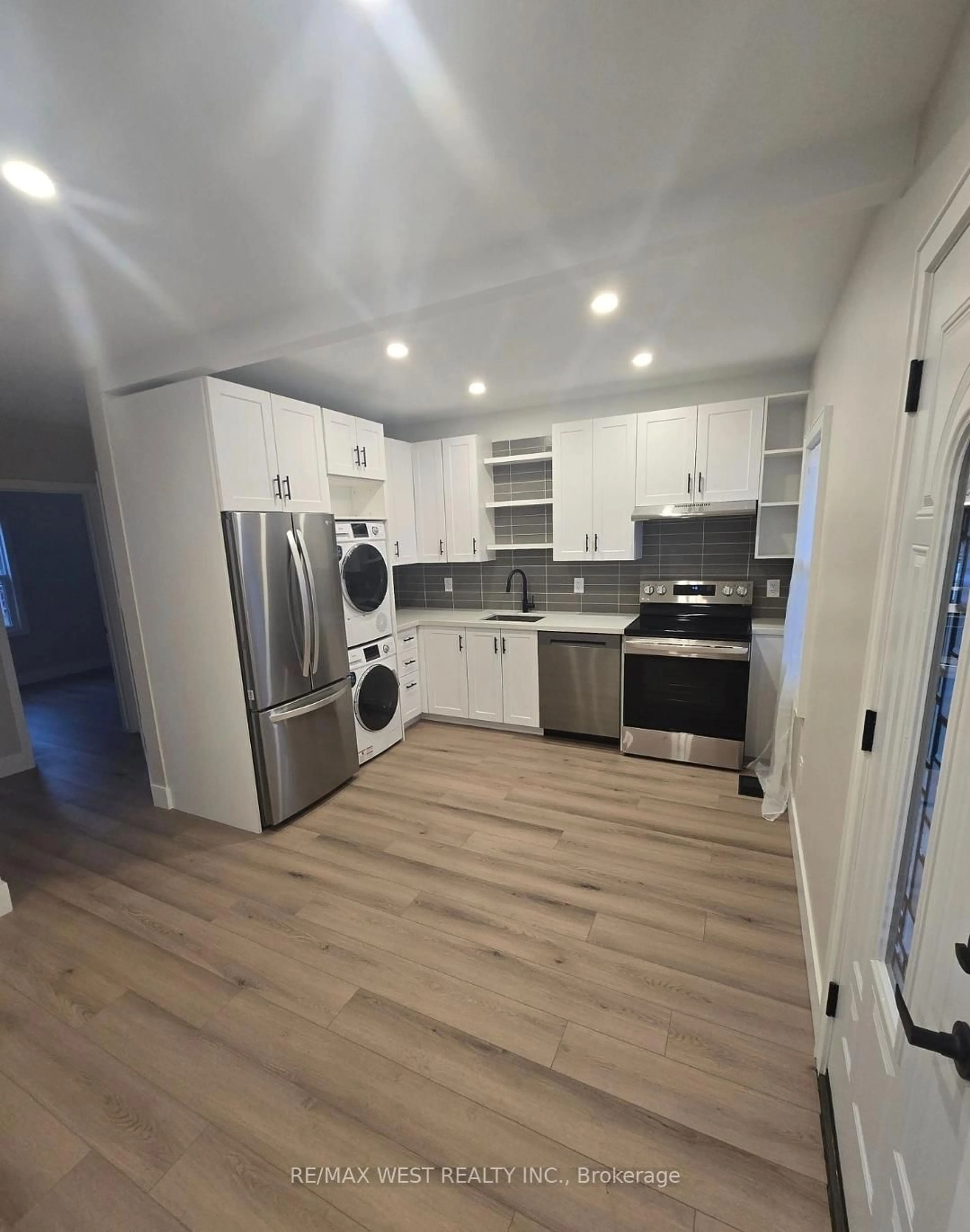 Open concept kitchen, wood/laminate floor for 413 Paling Ave, Hamilton Ontario L8H 5K3