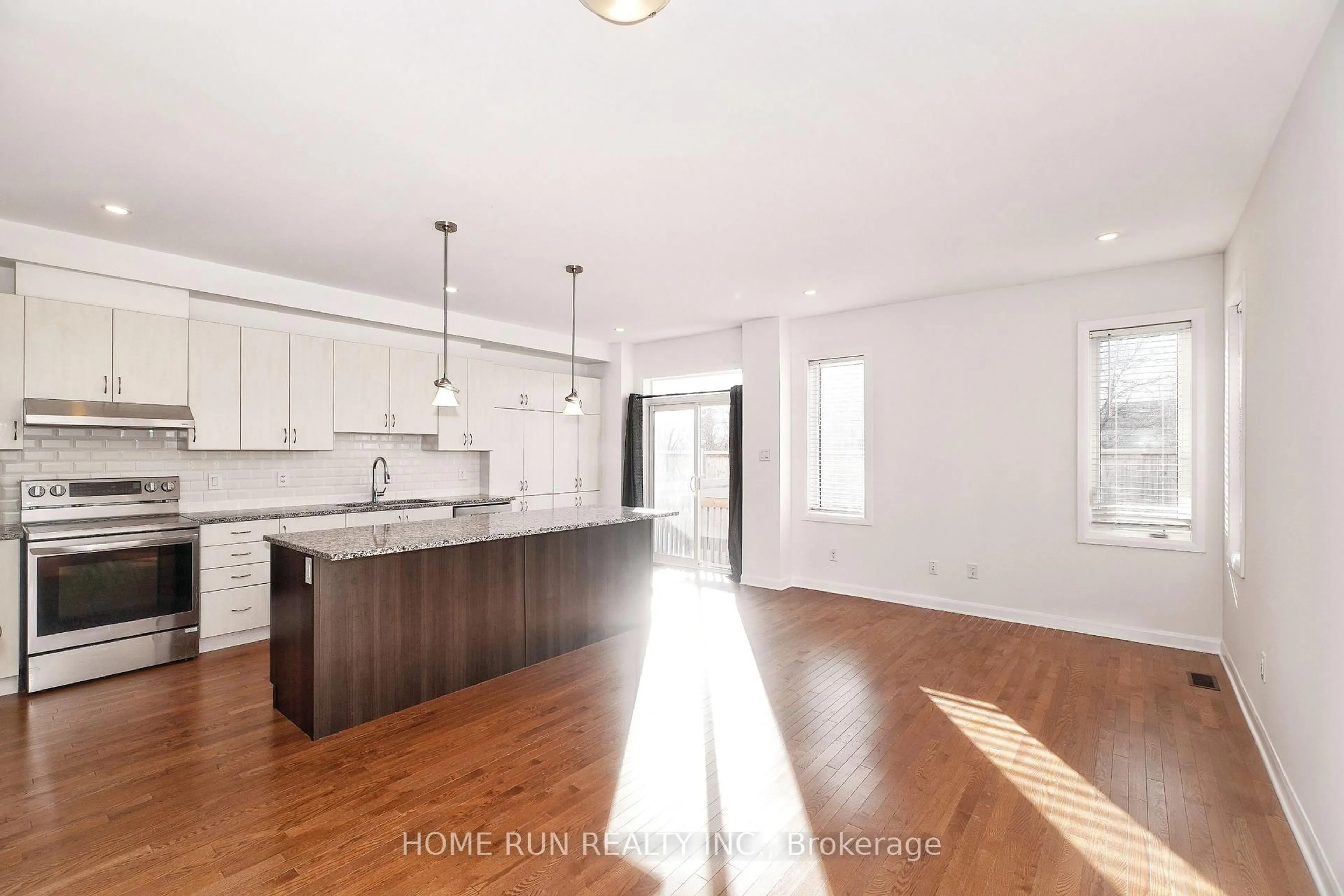 Open concept kitchen, wood/laminate floor for 552 Clemency Cres, Ottawa Ontario K2J 6R8