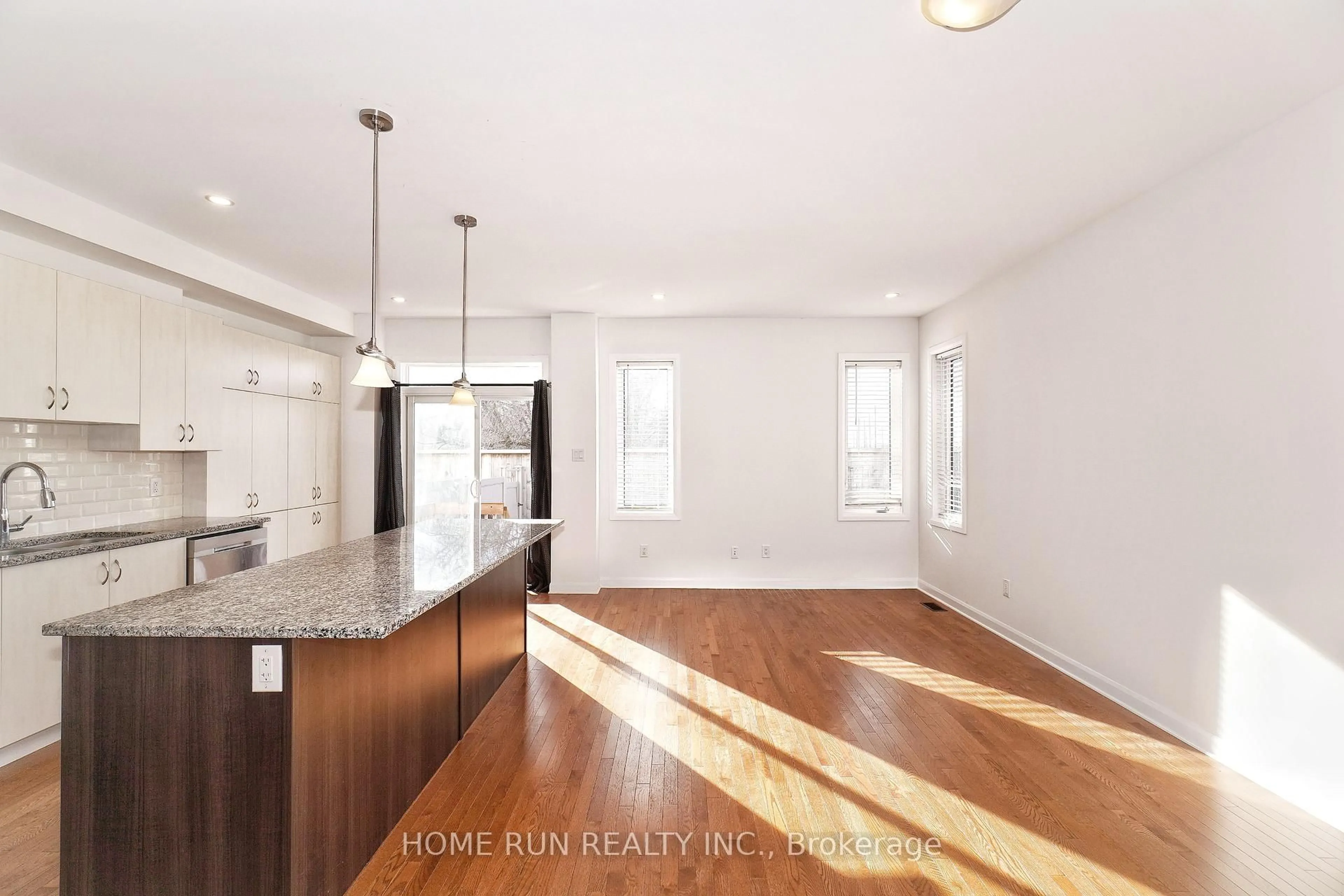 Open concept kitchen, wood/laminate floor for 552 Clemency Cres, Ottawa Ontario K2J 6R8