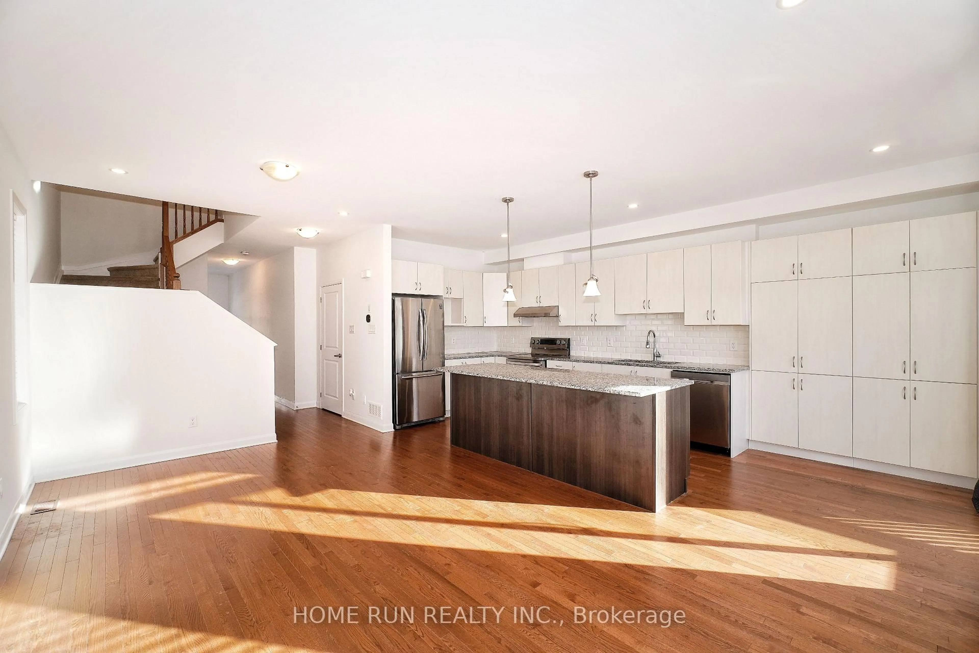 Open concept kitchen, wood/laminate floor for 552 Clemency Cres, Ottawa Ontario K2J 6R8