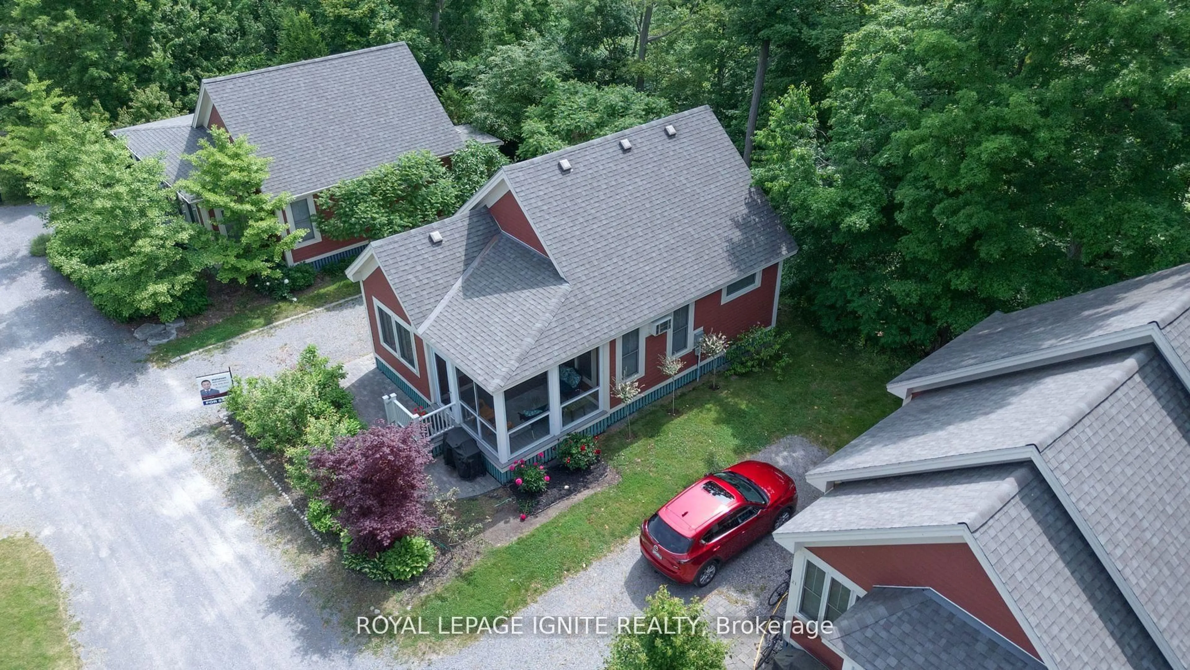 A pic from outside/outdoor area/front of a property/back of a property/a pic from drone, street for 19 Summer Village Lane #208, Prince Edward County Ontario K0K 1P0