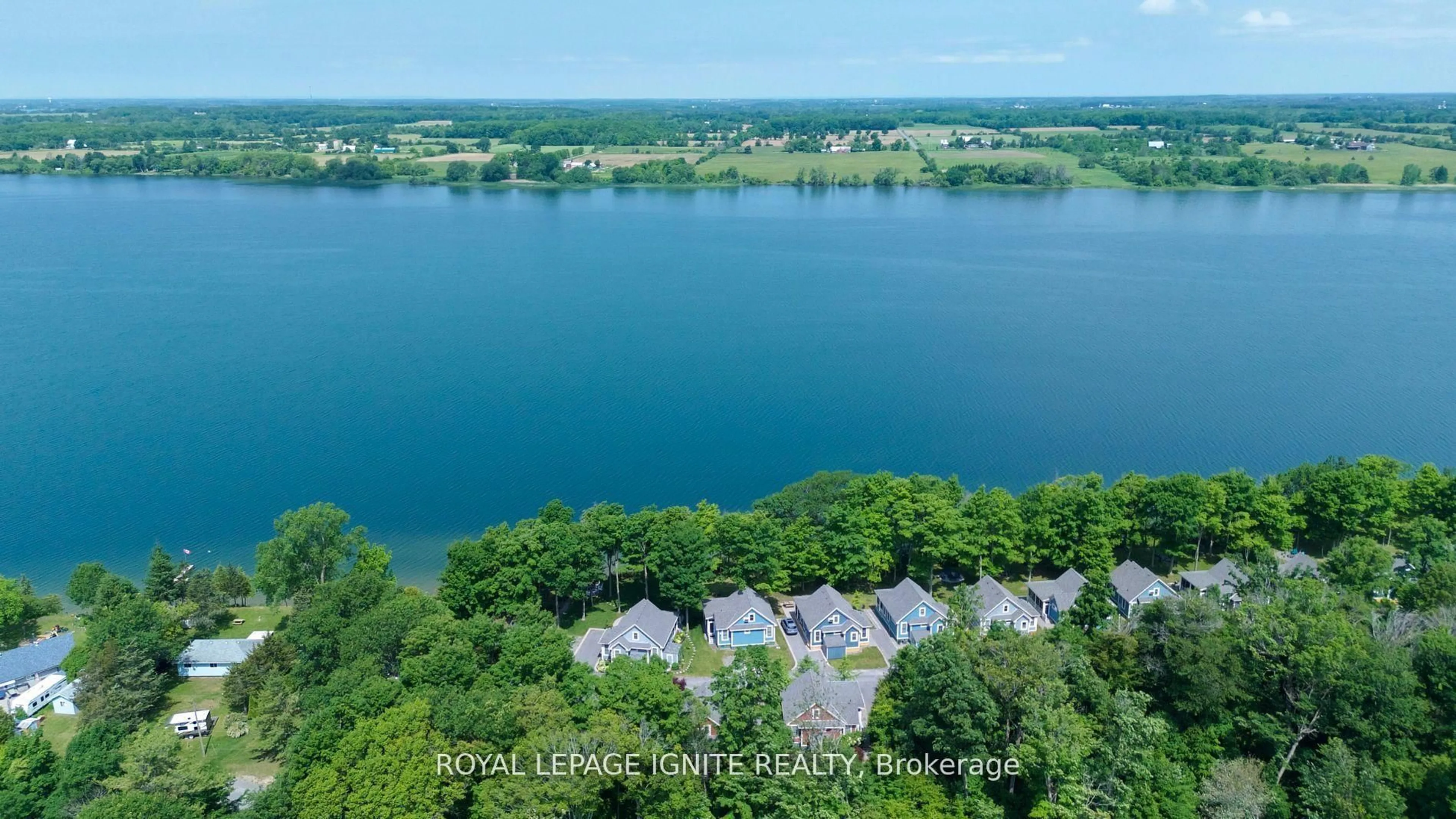 A pic from outside/outdoor area/front of a property/back of a property/a pic from drone, water/lake/river/ocean view for 19 Summer Village Lane #208, Prince Edward County Ontario K0K 1P0