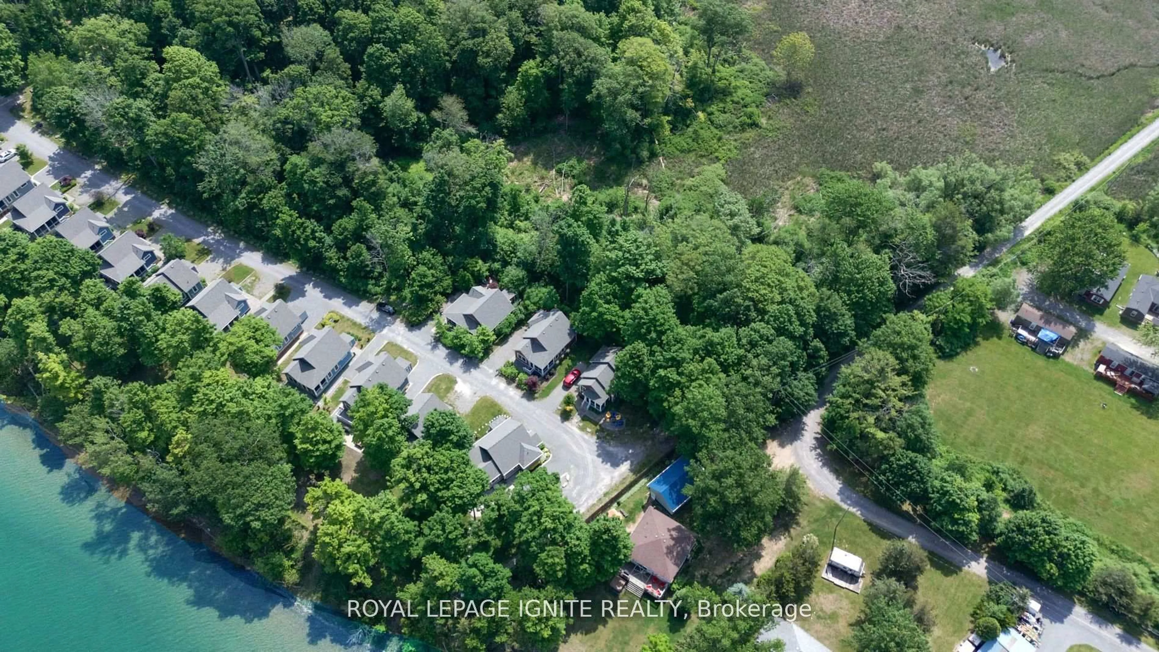 A pic from outside/outdoor area/front of a property/back of a property/a pic from drone, water/lake/river/ocean view for 19 Summer Village Lane #208, Prince Edward County Ontario K0K 1P0