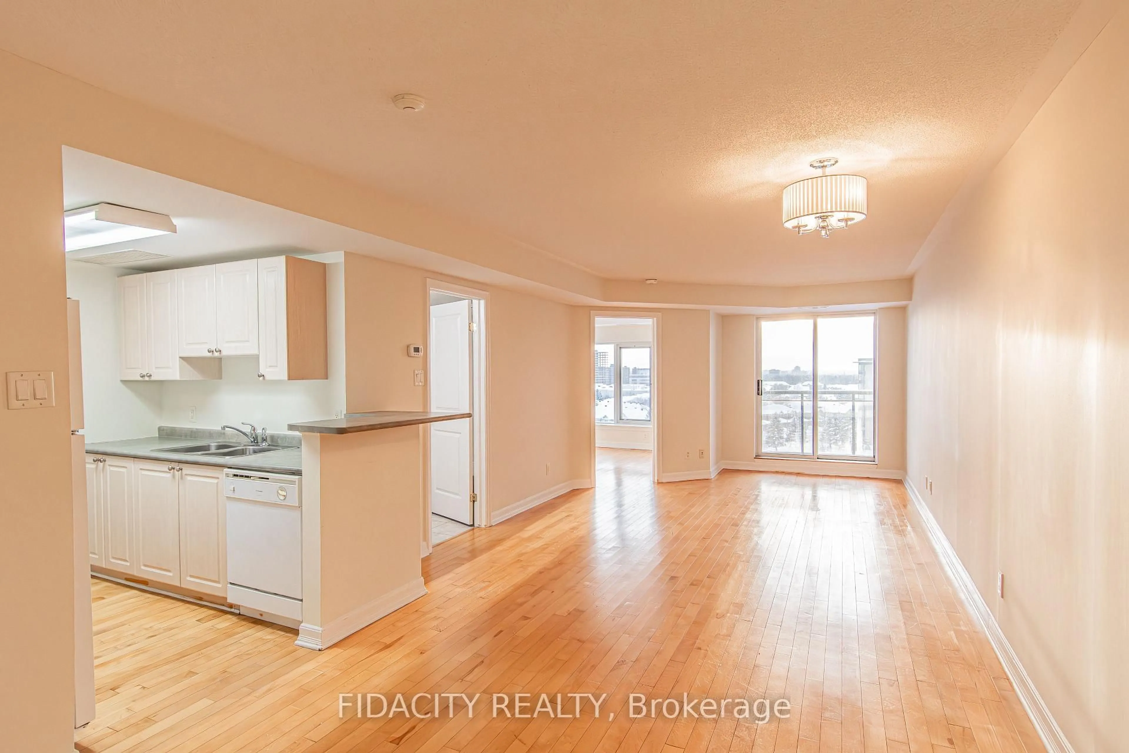 Open concept kitchen, wood/laminate floor for 310 Central Park Dr #9G, Ottawa Ontario K2C 4G4