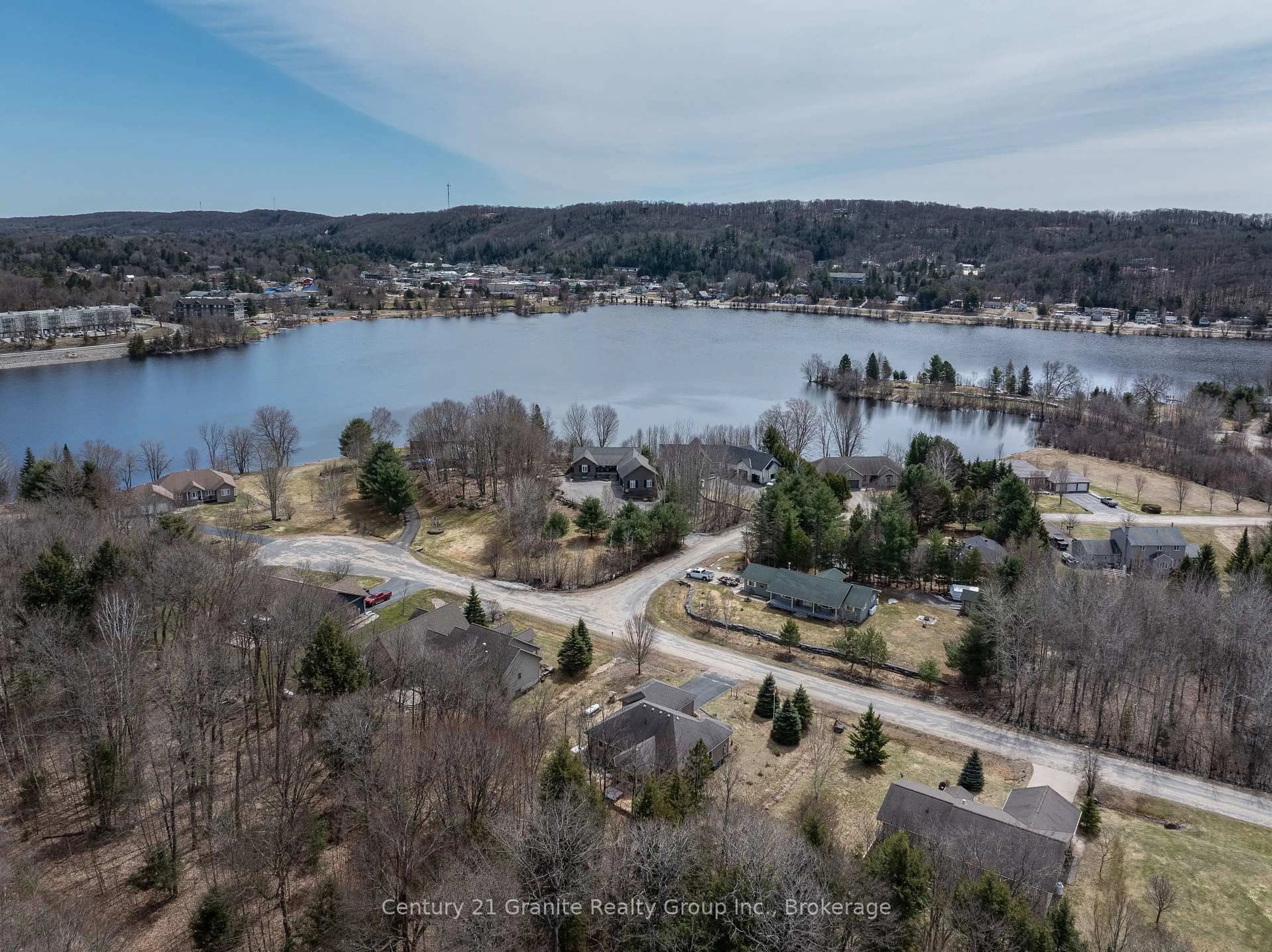 A pic from outside/outdoor area/front of a property/back of a property/a pic from drone, water/lake/river/ocean view for 117 Halbiem Cres, Dysart et al Ontario K0M 1S0