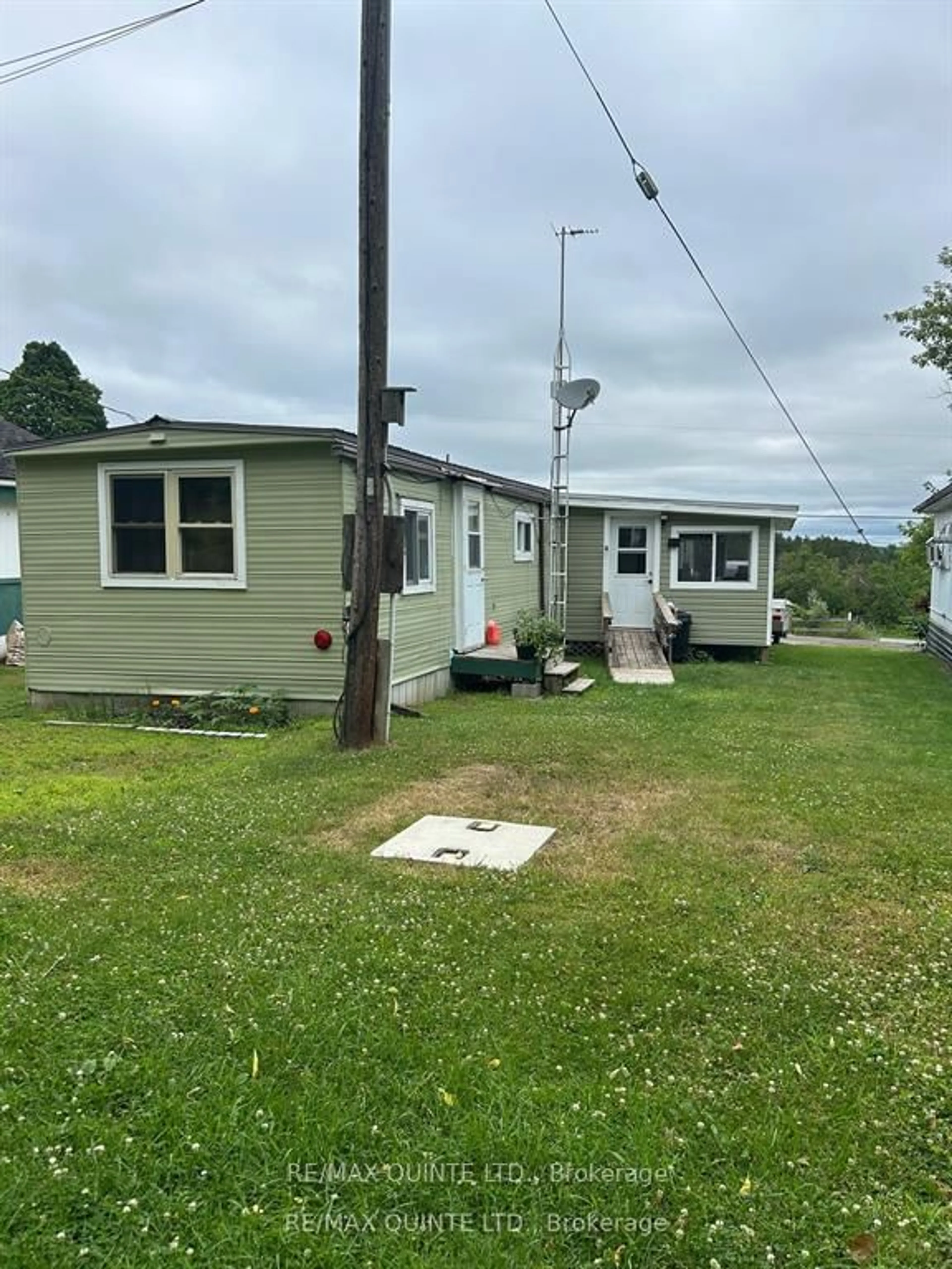 A pic from outside/outdoor area/front of a property/back of a property/a pic from drone, street for 223B Clare St, Thomasburg Ontario K0K 3H0