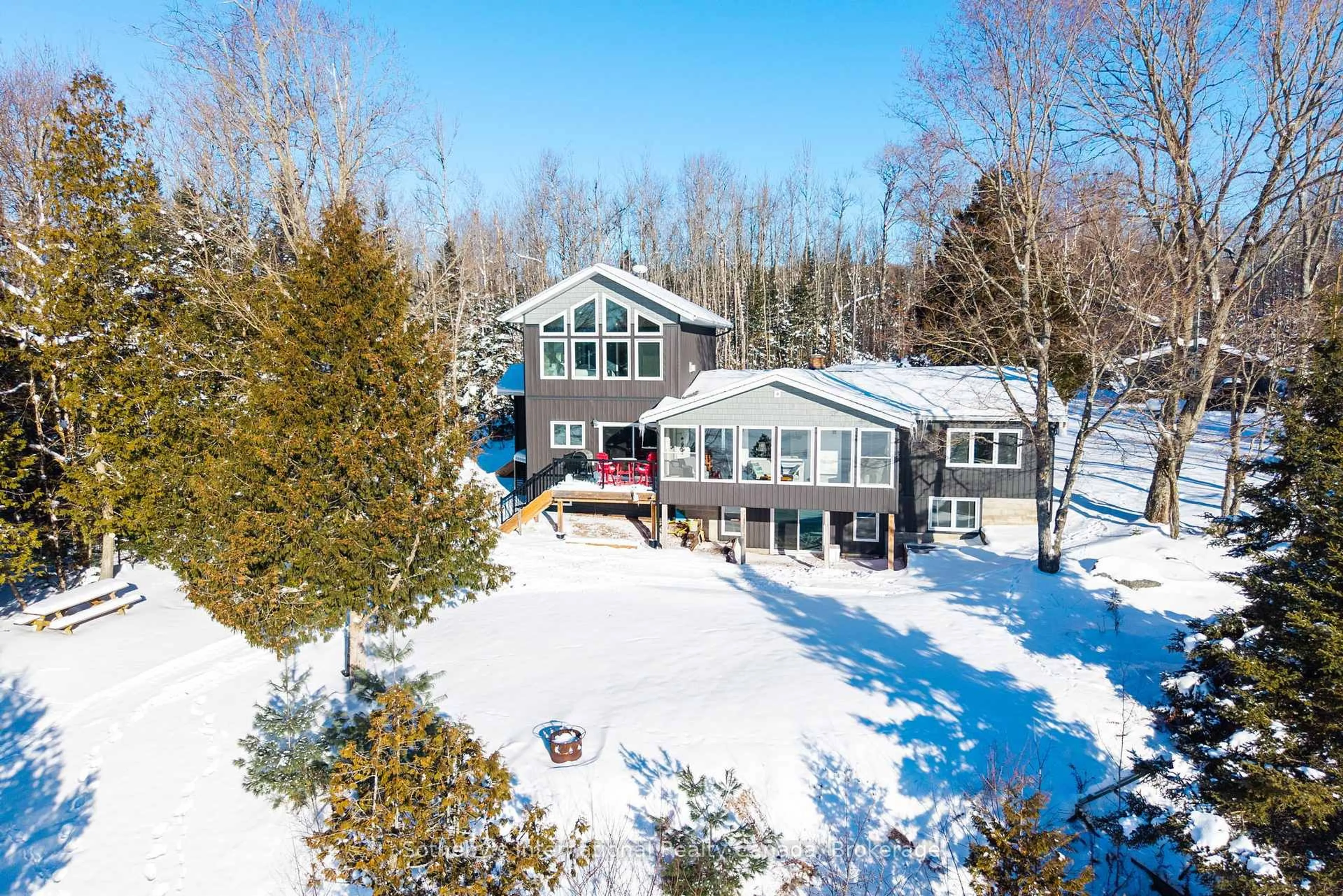 A pic from outside/outdoor area/front of a property/back of a property/a pic from drone, water/lake/river/ocean view for 126 CHAPMAN Dr, Magnetawan Ontario P0A 1P0