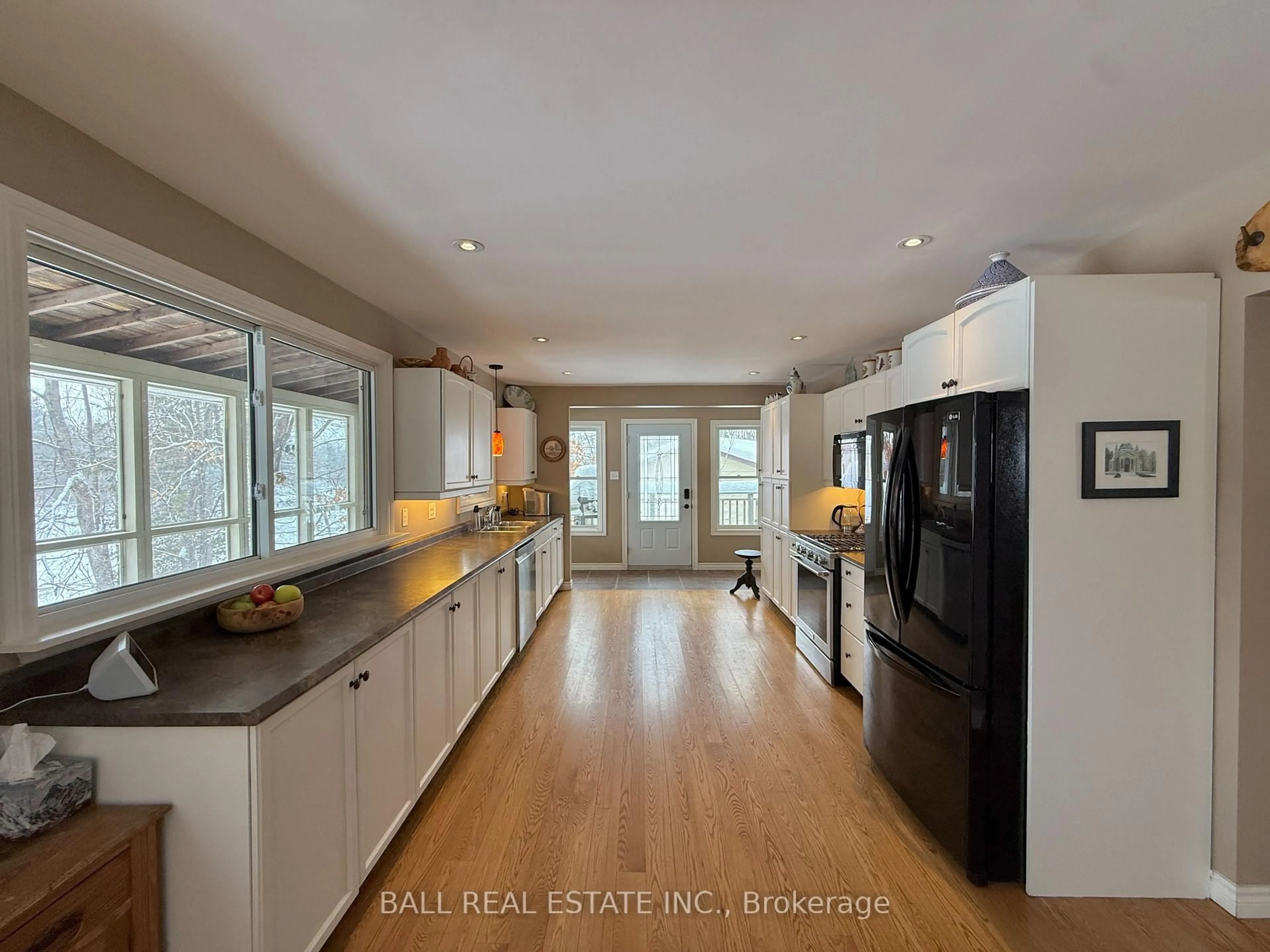 Open concept kitchen, wood/laminate floor for 50 Fire Route 10B, North Kawartha Ontario K0L 3E0