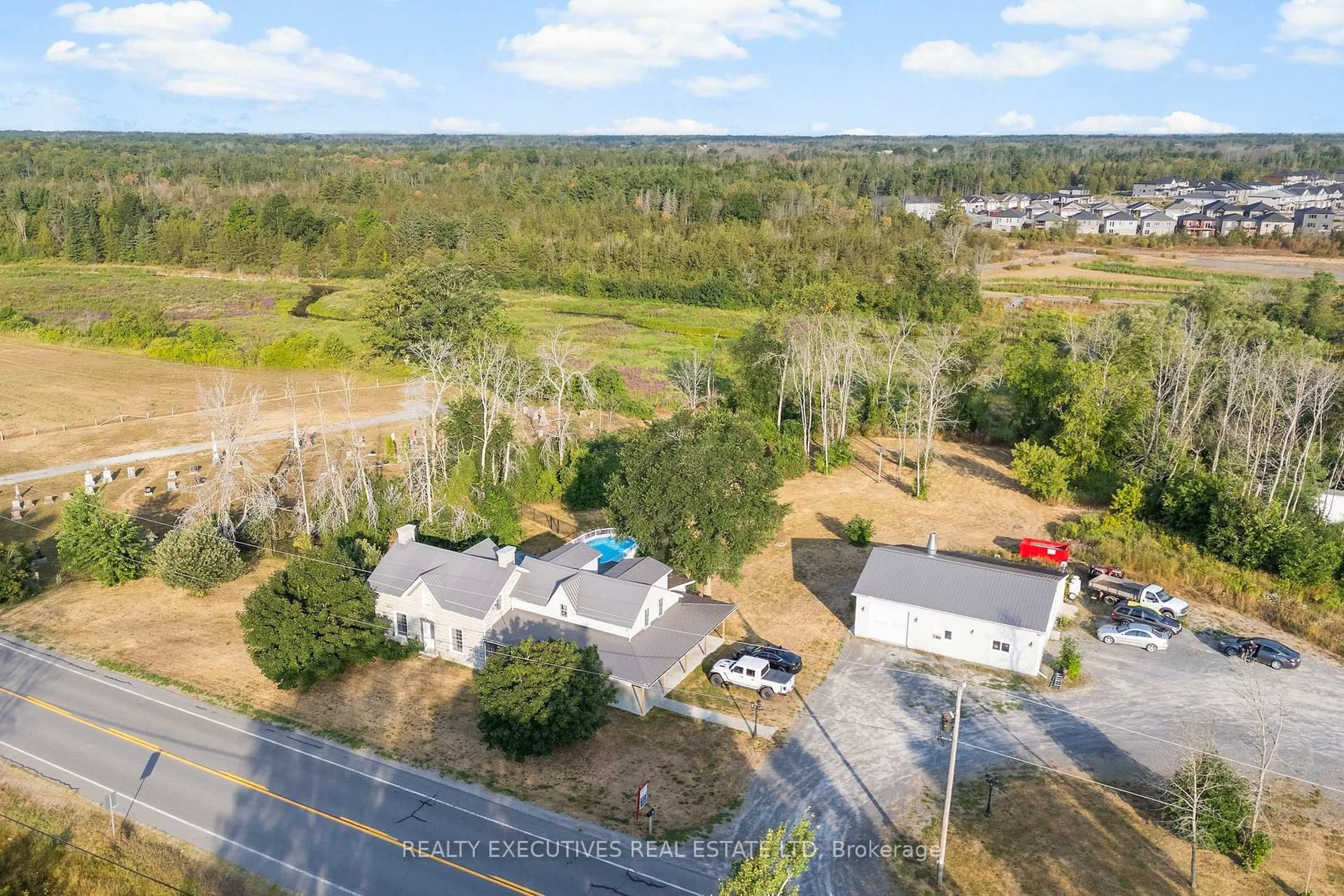 A pic from outside/outdoor area/front of a property/back of a property/a pic from drone, water/lake/river/ocean view for 456 Millhaven Rd, Bissett Creek Ontario K0H 2H0