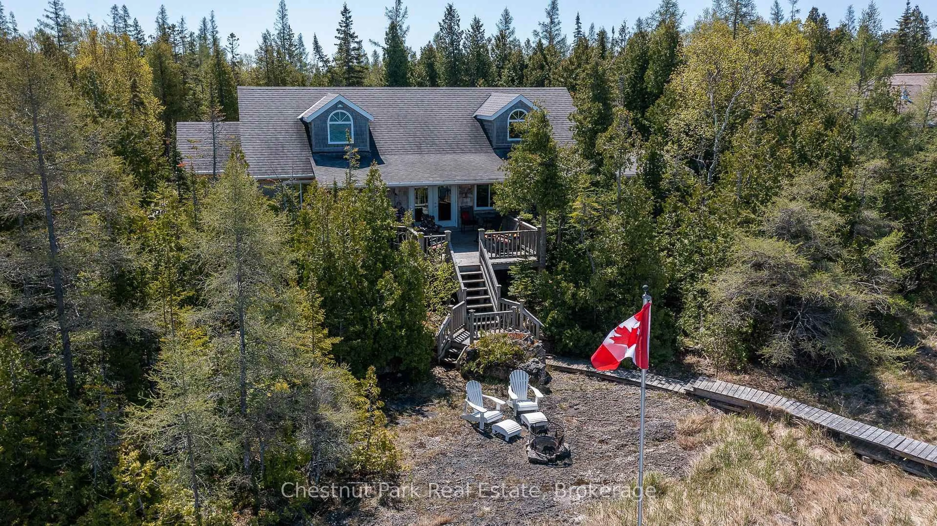 A pic from outside/outdoor area/front of a property/back of a property/a pic from drone, mountain view for 94 Zorra Dr, Northern Bruce Peninsula Ontario N0H 2R0
